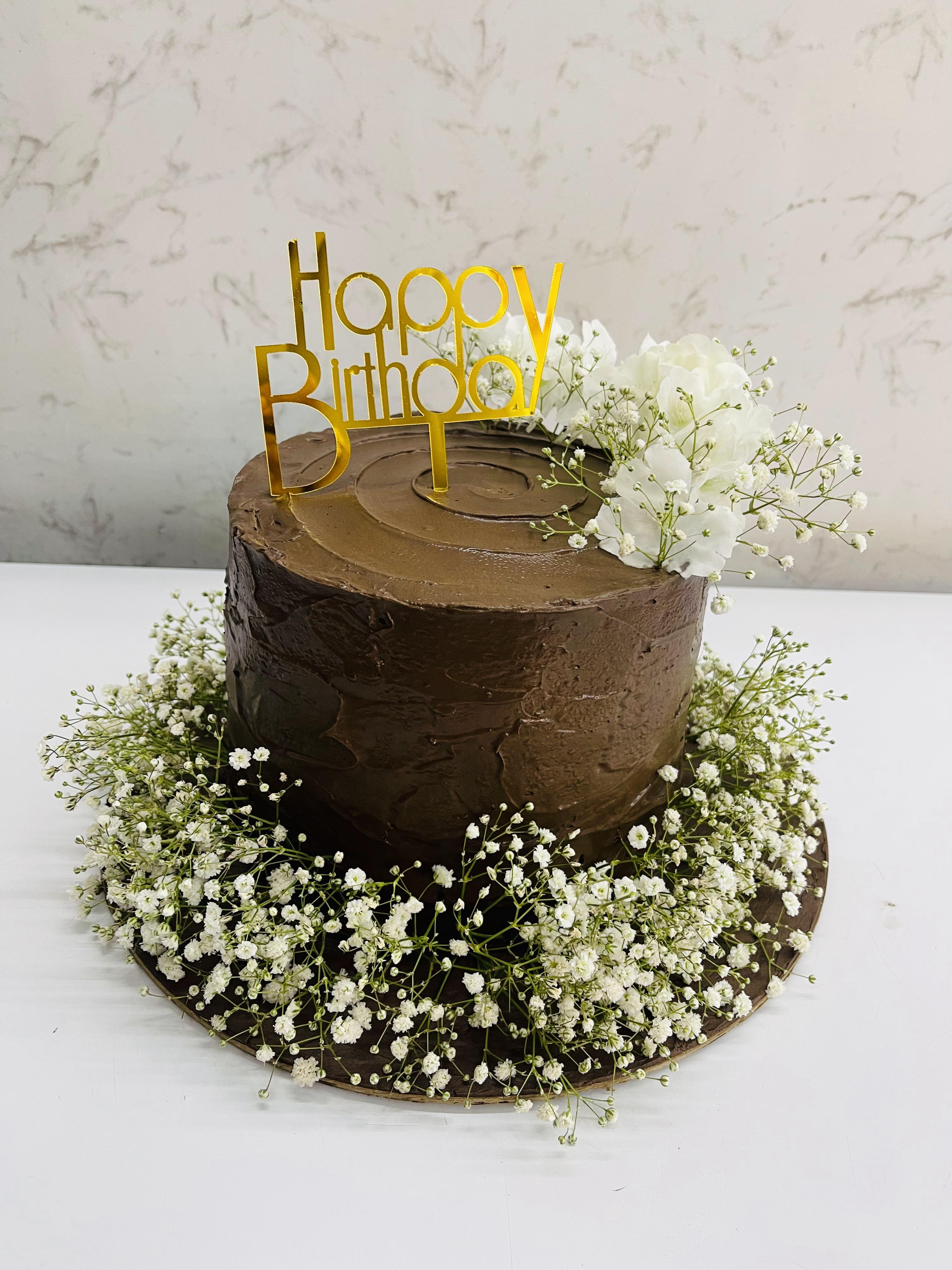Chocolate Cake With White Flowers