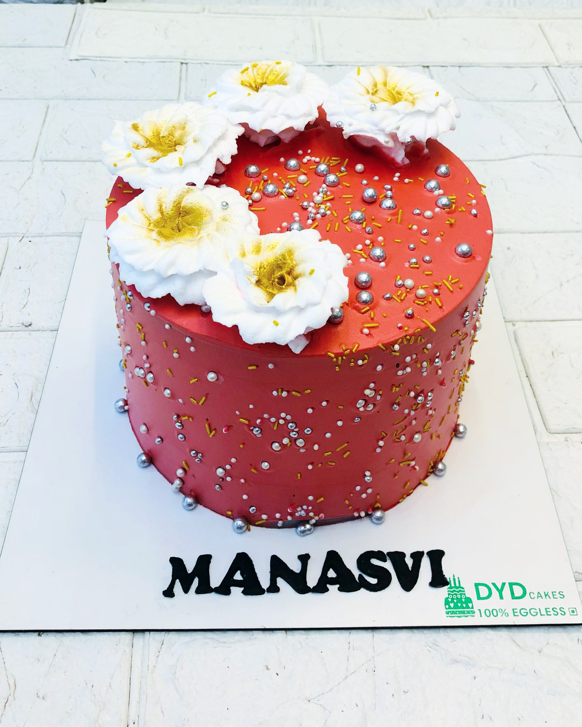 Red Cake With White Florals