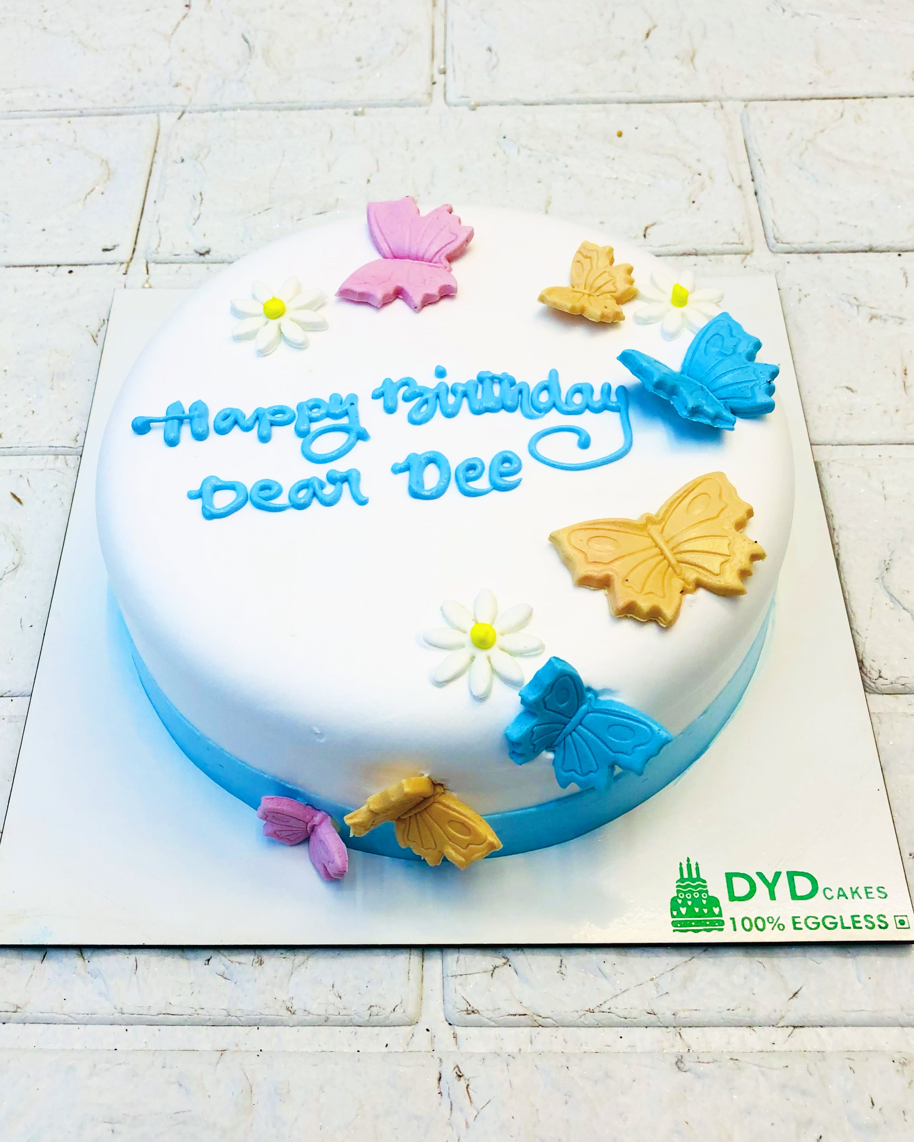 Colorful Butterflies On White Cake