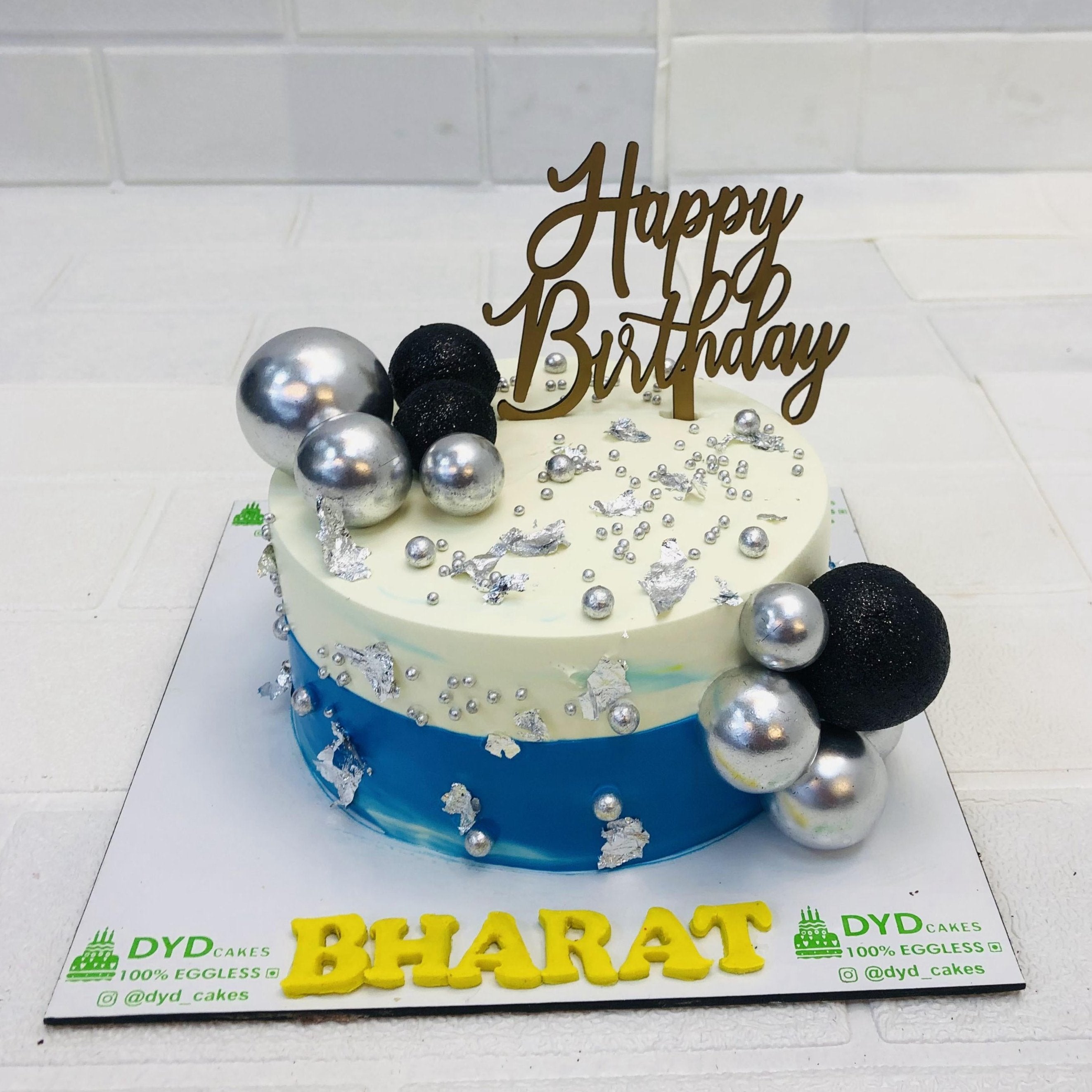 Silver Balls On White Golden Cake
