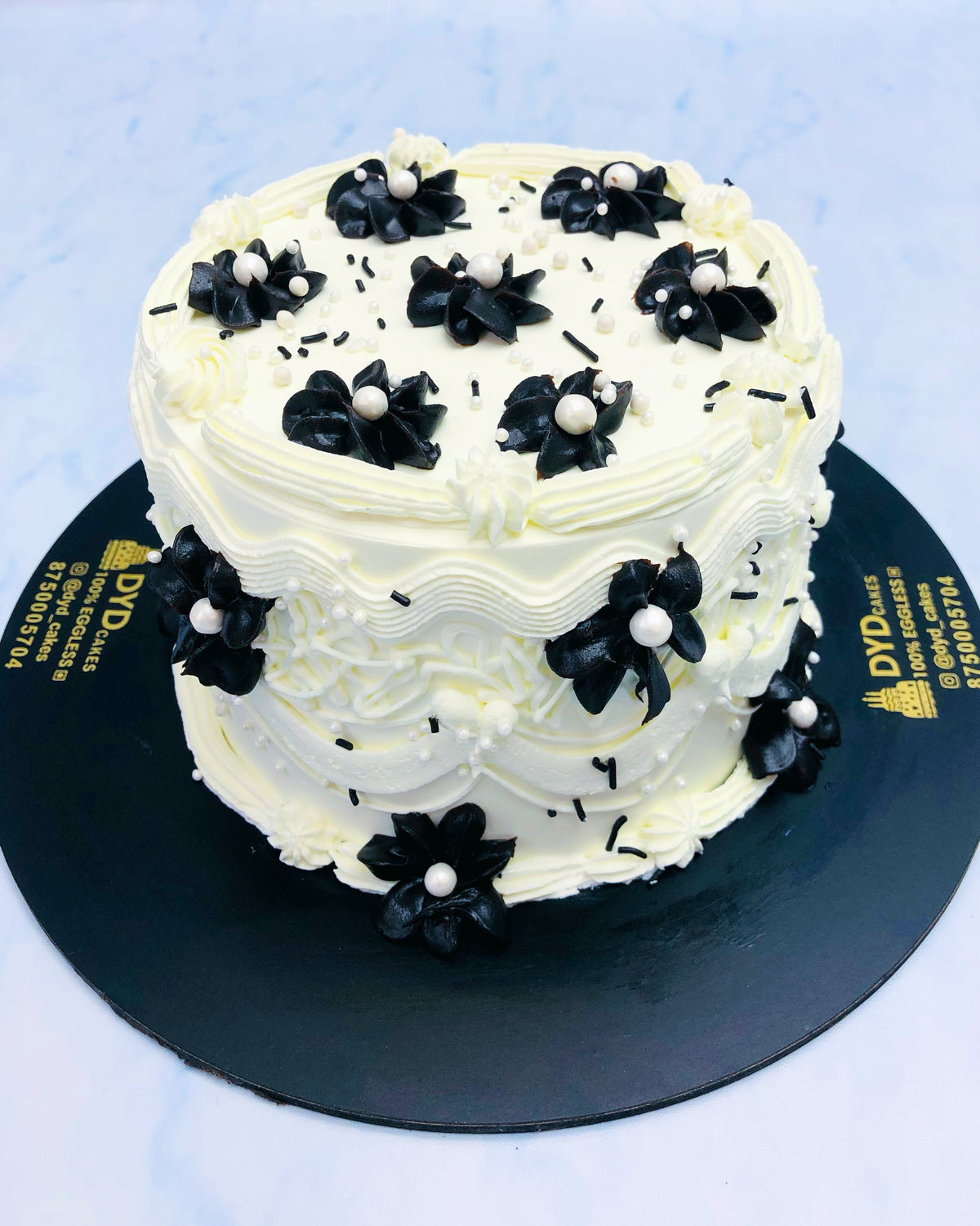 Black Flowers on White Beautiful Cake