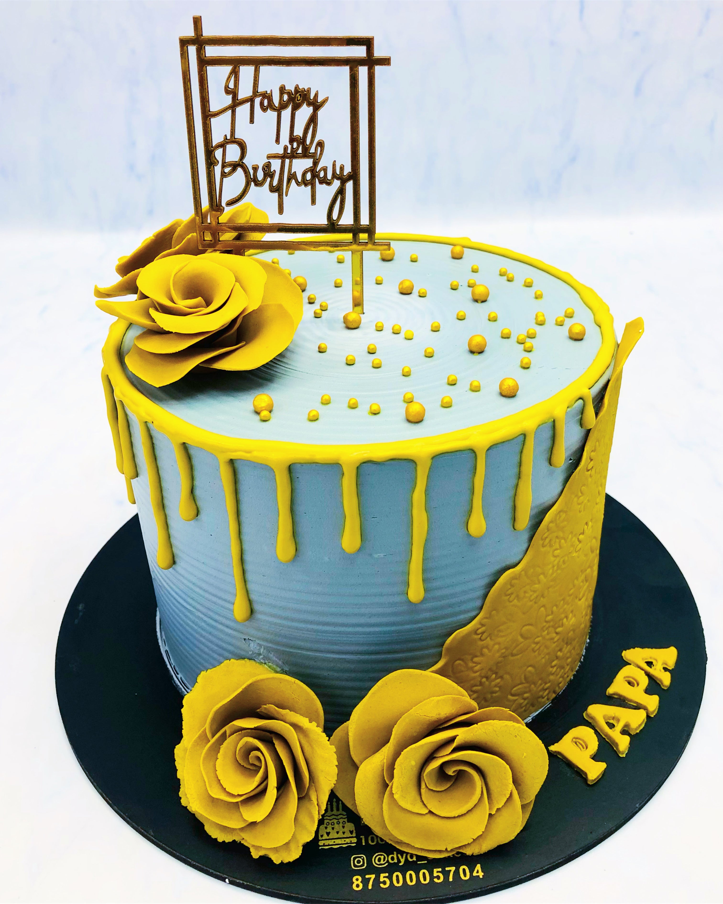 Golden Flowers on Sky Blue Cake