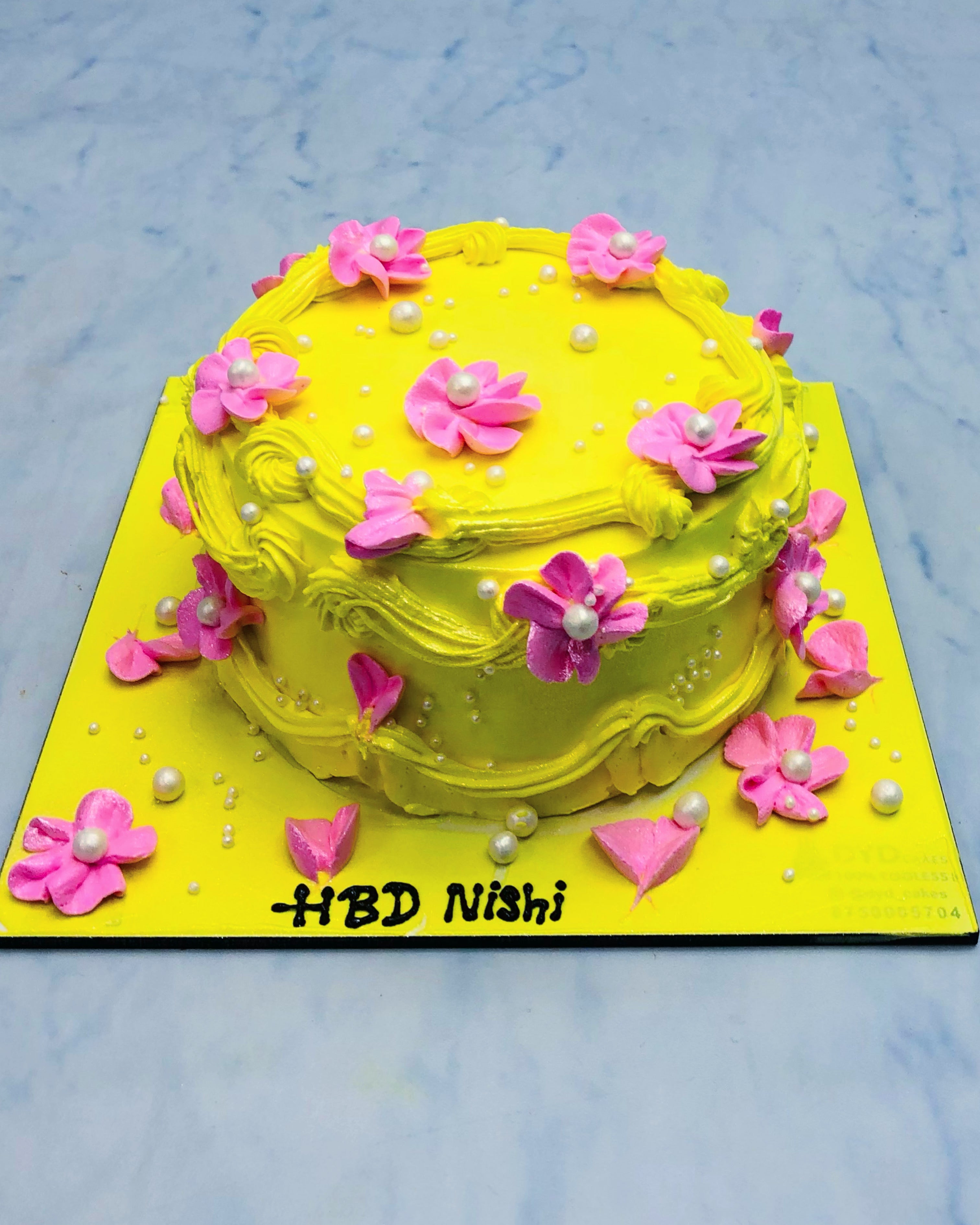 Yellow Cake With Pink Flowers