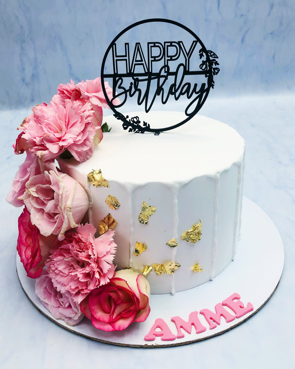 Fresh Roses on Beautiful White Cake