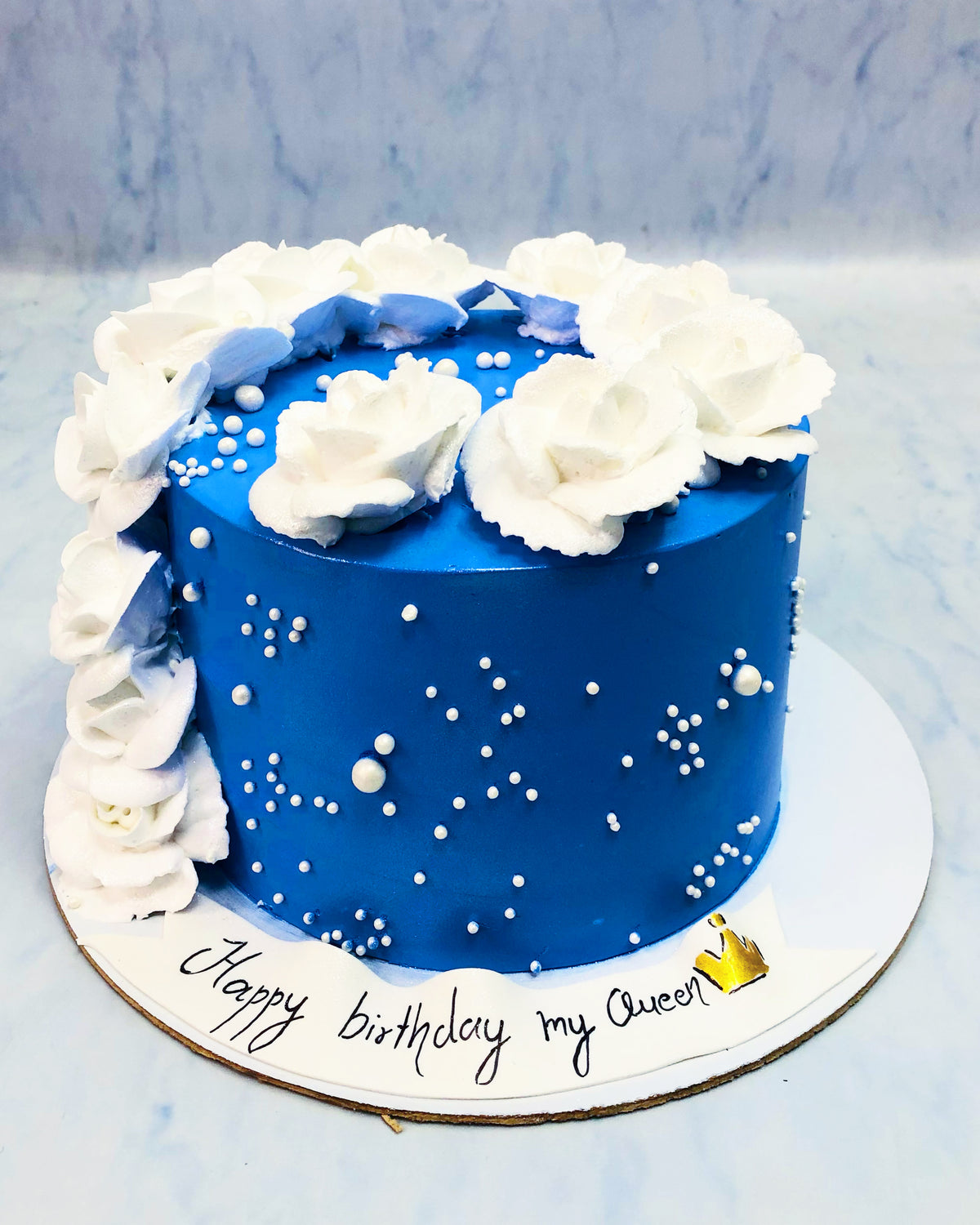 Shiny Blue Cake with White Floral Theme
