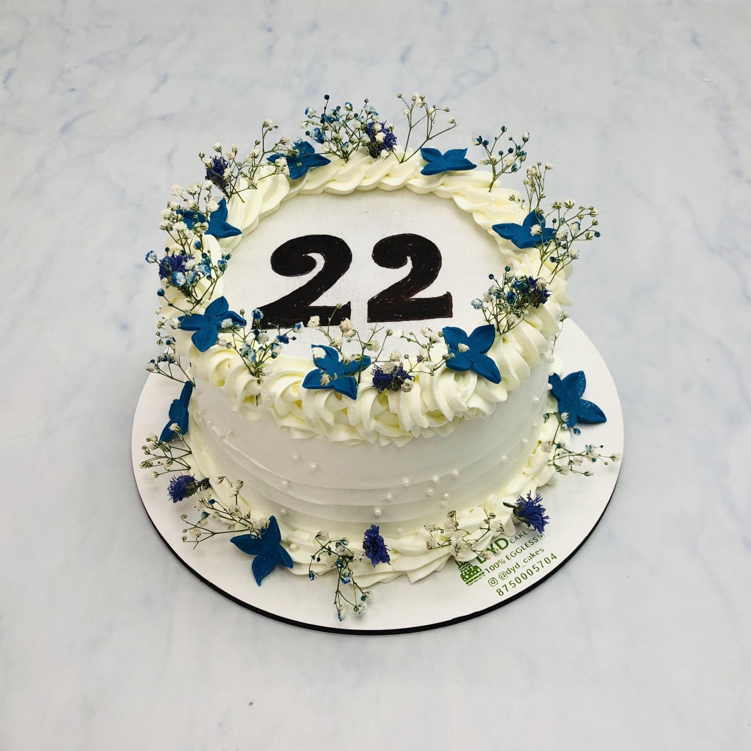 White Cake with Blue White Florals