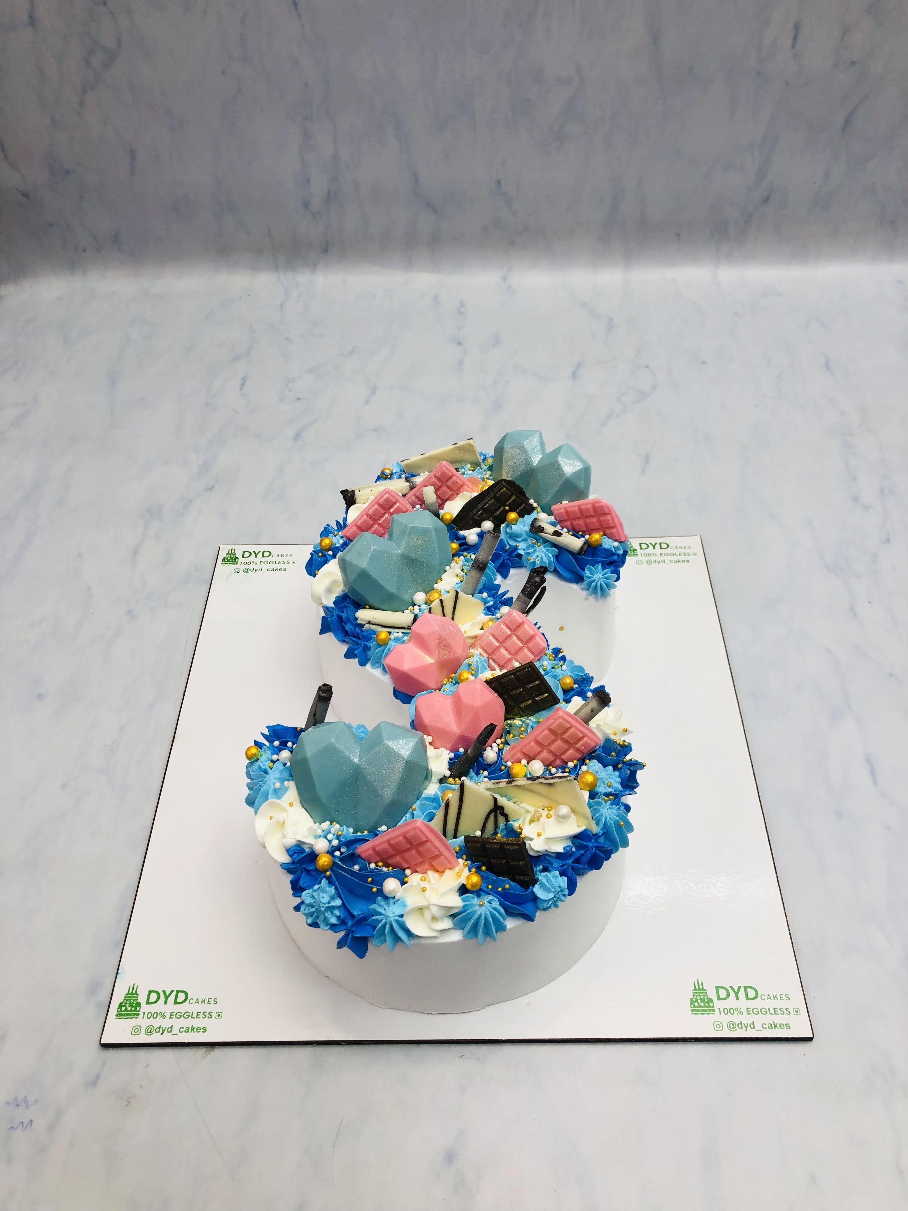 Beautiful Pink Blue Chocolates Monogram Cake