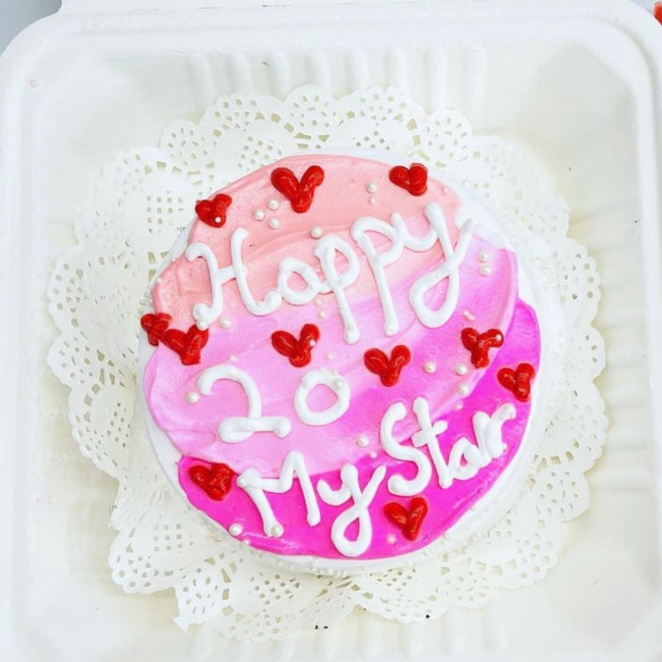 A birthday cake in a box accompanied by a note reading "Happy 20th Birthday," celebrating a special milestone.