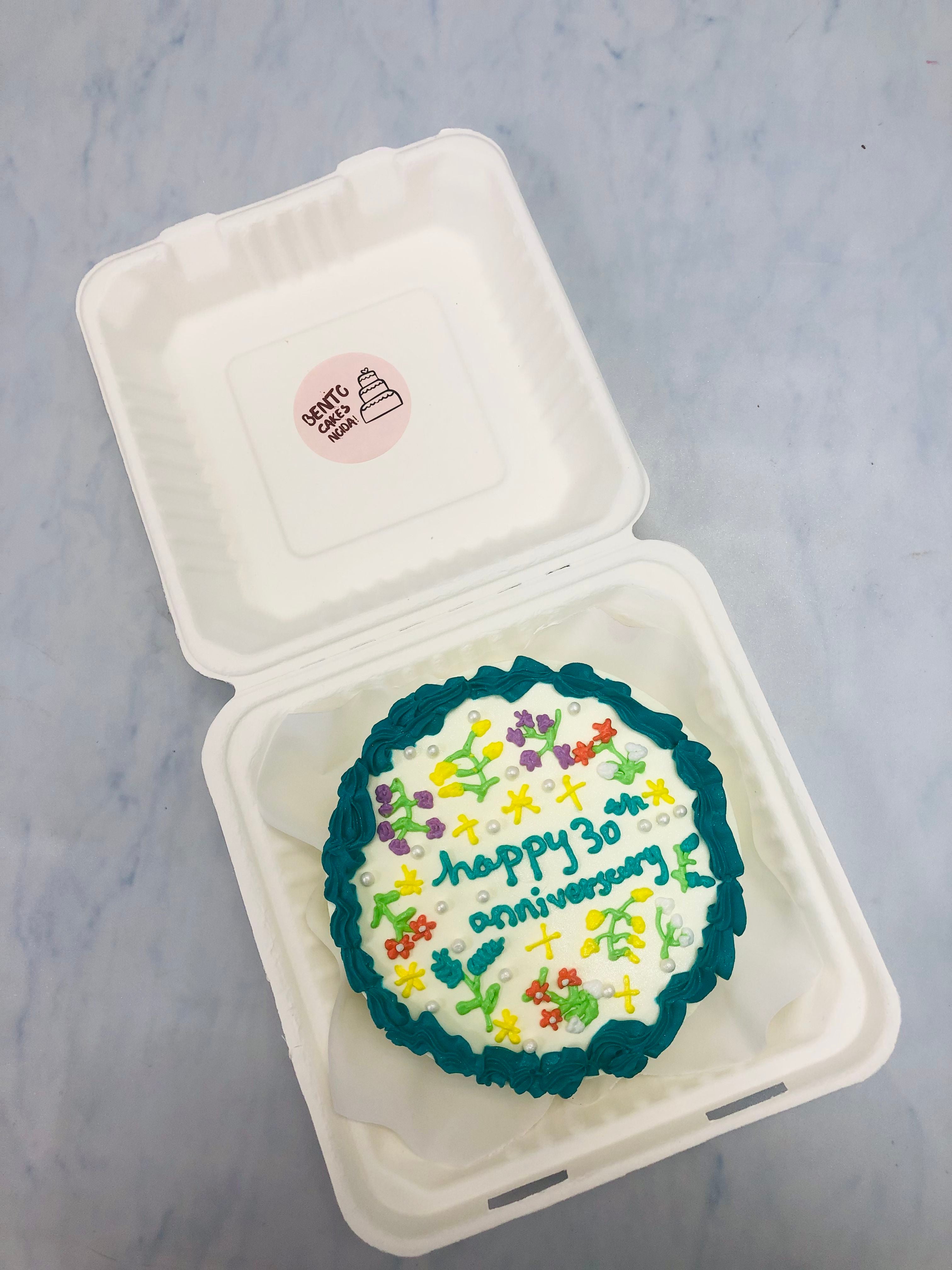 This Bento cake is designed with beautiful flowers design and its specially for anniversary cake.