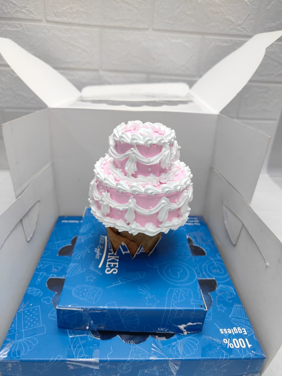 Pink with White colour cone cake