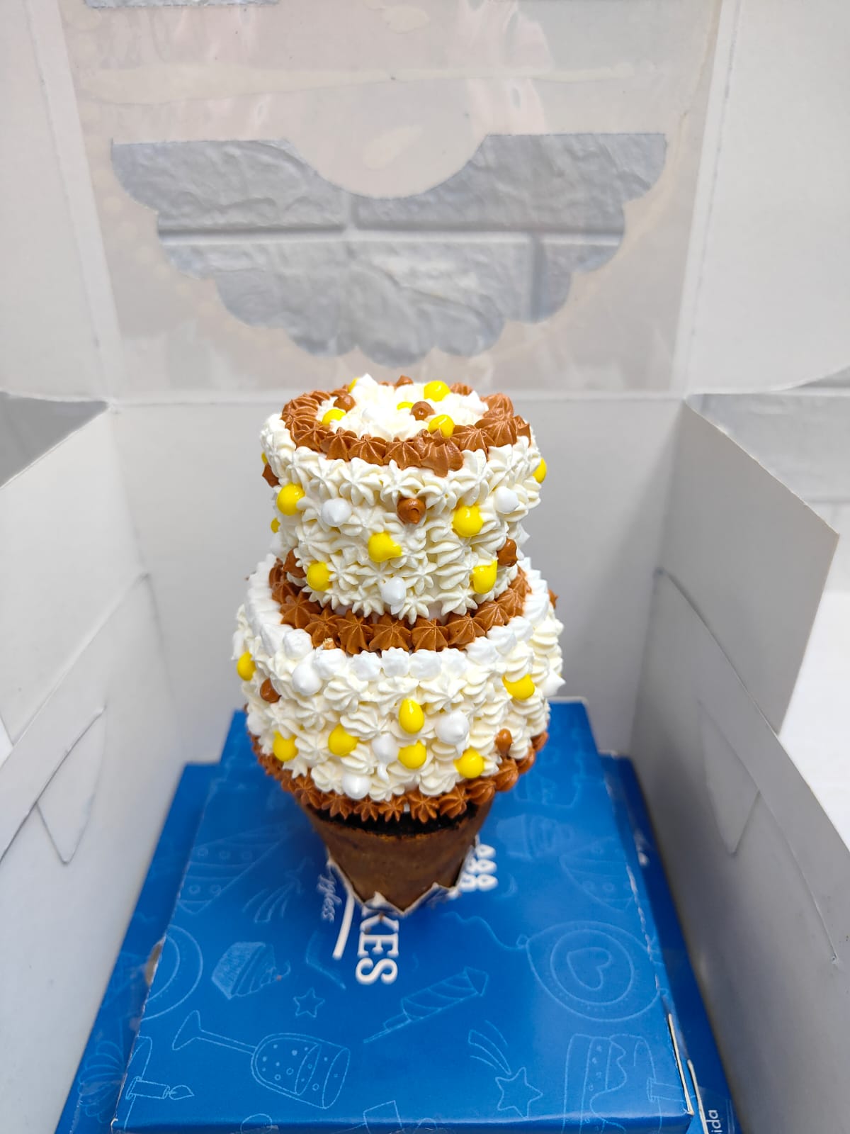 White & Brown Frosting cone cake