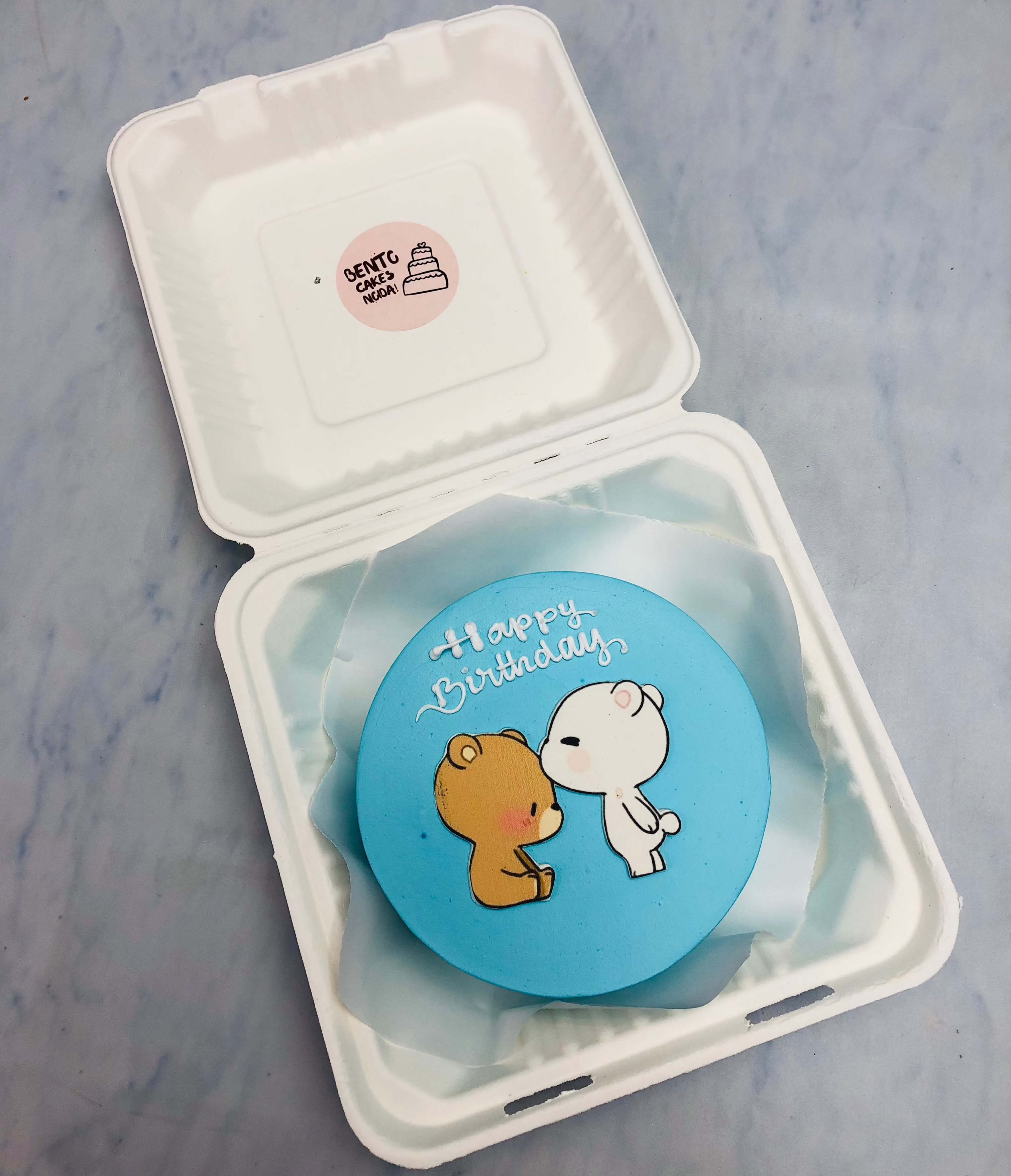 Alight blue bento cake having dudu forhead kissing to dudu.