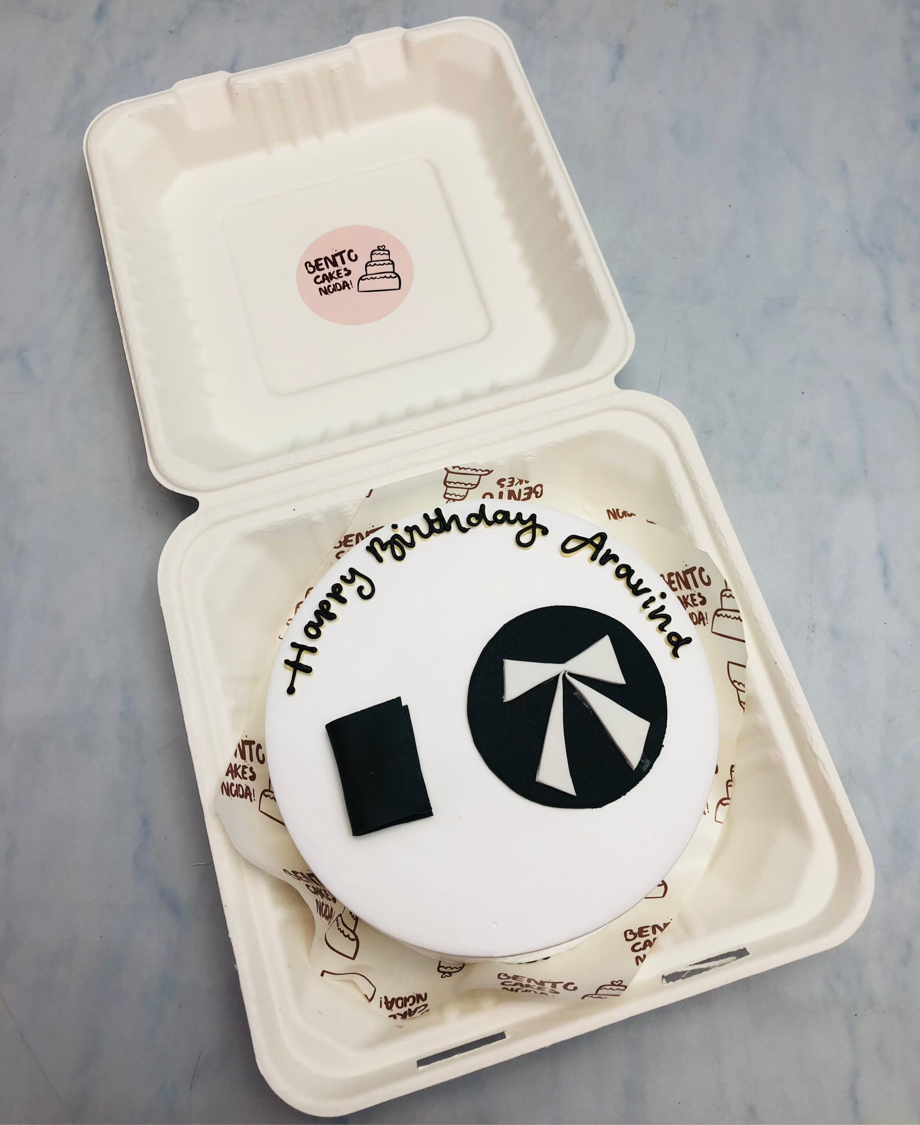 A white bento cake with law theme for lawyers birthday.