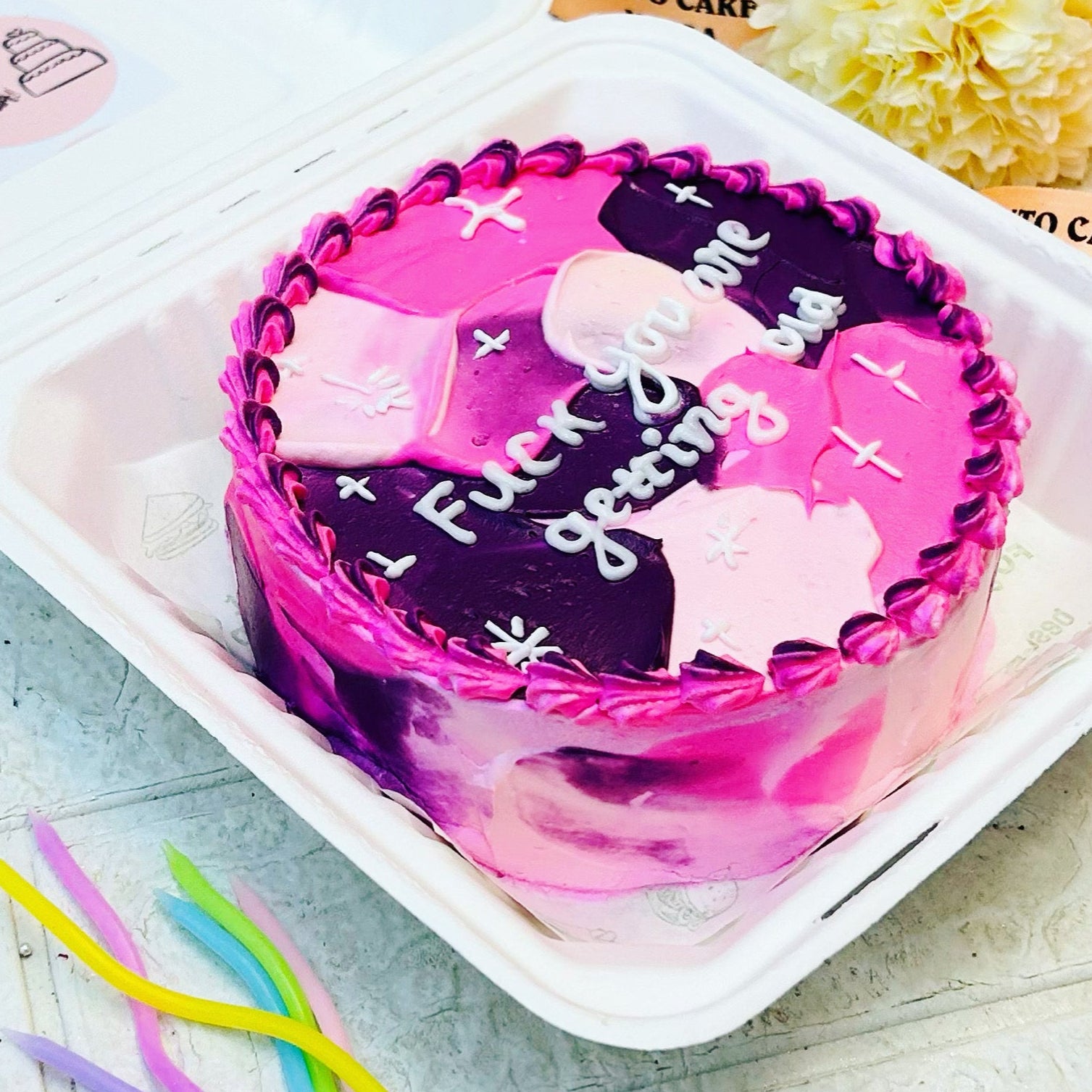 A delightful cake with a decorative bow, sitting on a table, inviting everyone to enjoy a sweet treat.