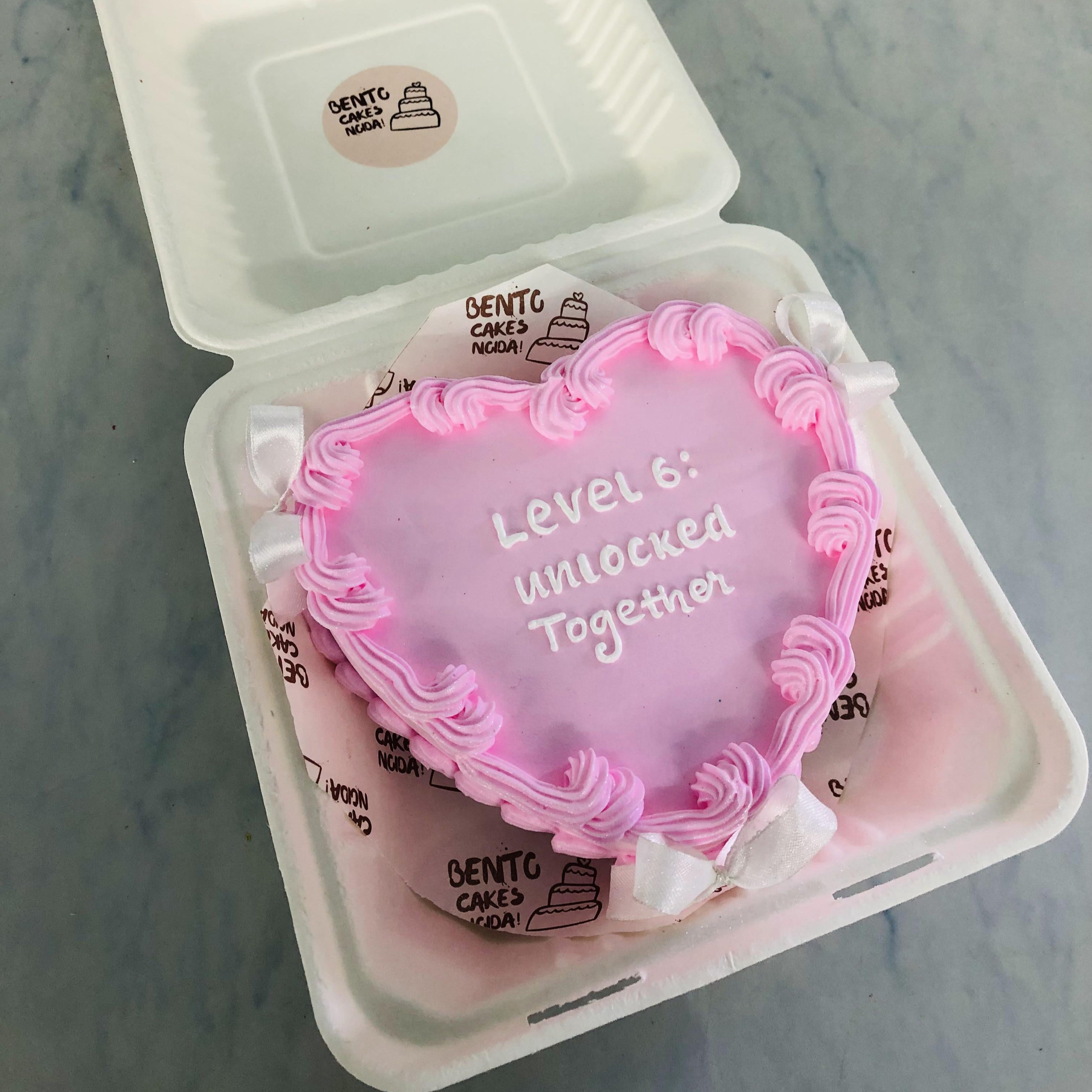 Anniversary Theme Pink Heart Bento with pink boundaries nd white text on it.