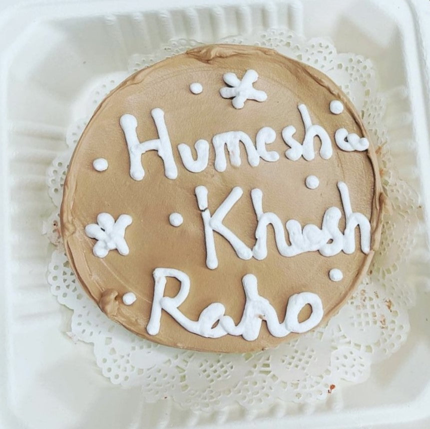 Peach color bento cake is beautifully designed and 'Hamesha Khush Raho' meaasage written on the top.