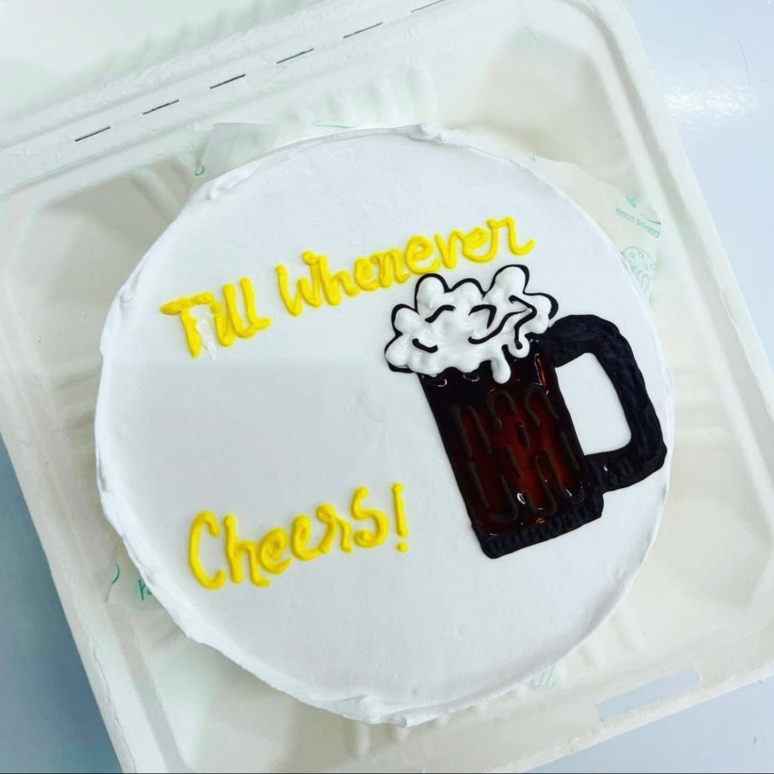 A delicious cake topped with a frosty beer mug, perfect for a celebration or a fun gathering.