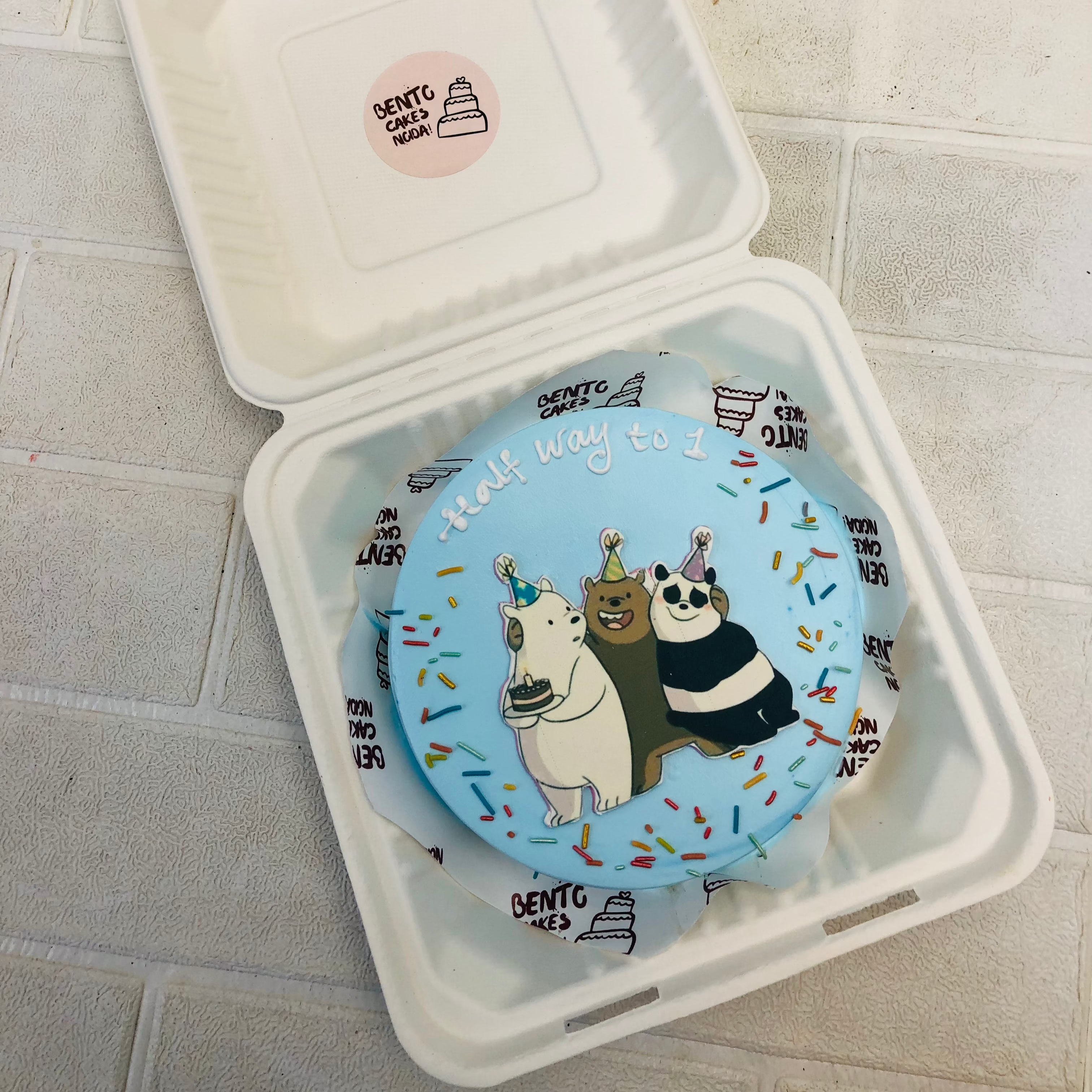 A skyblue bento cake with 3 bears print for 6 months baby.