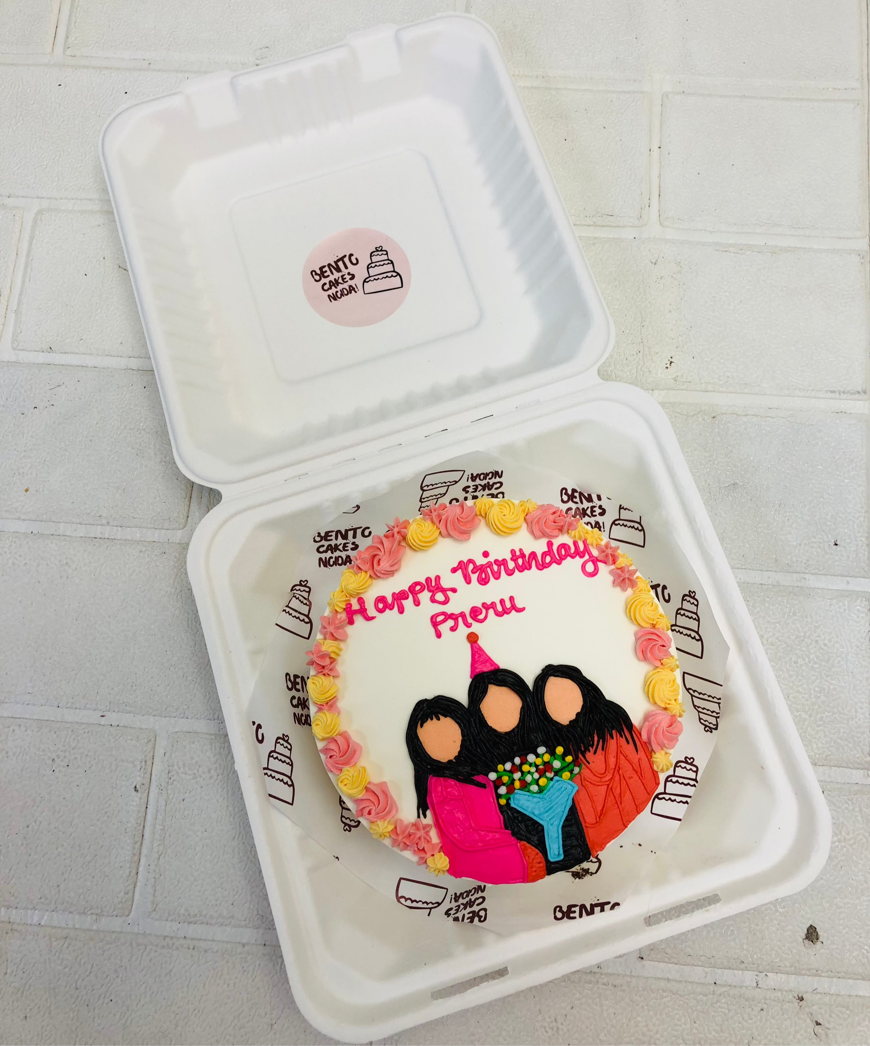 Floral bento cake with 3 friends celebrating birthday bento cake.