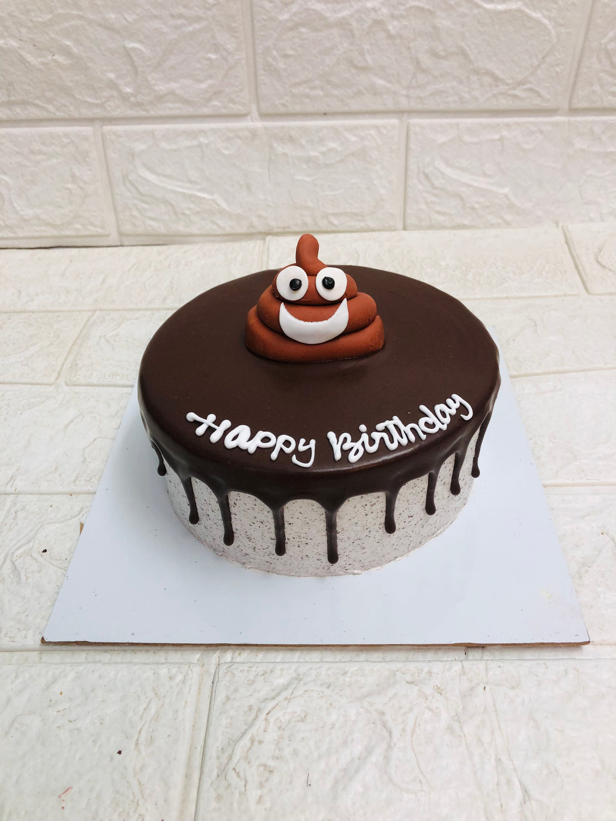 Birthday Chocolate Drip Cake with Poop Emoji Topper