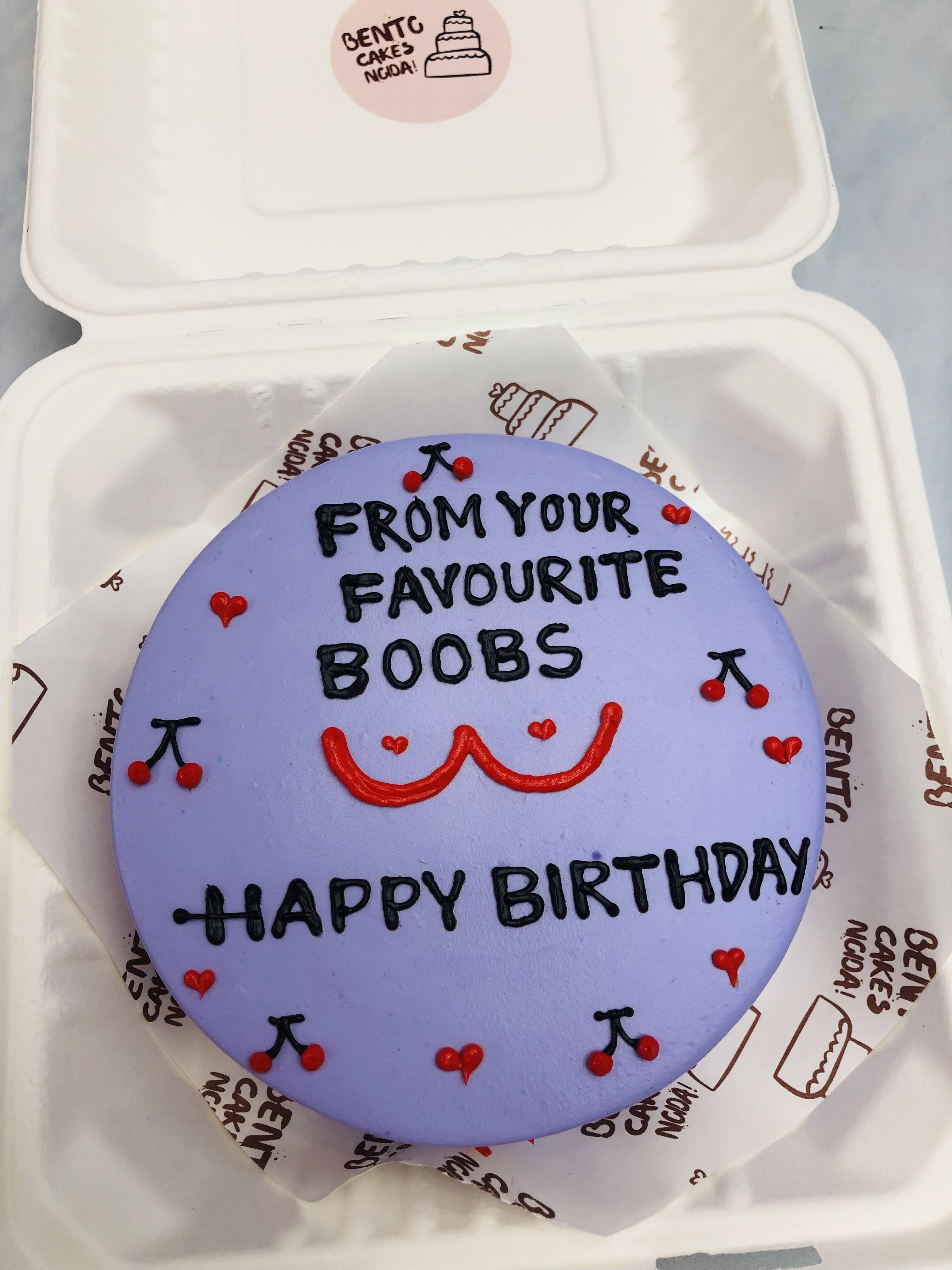 A purple bento cake decorated with red berries and some bachelor content.