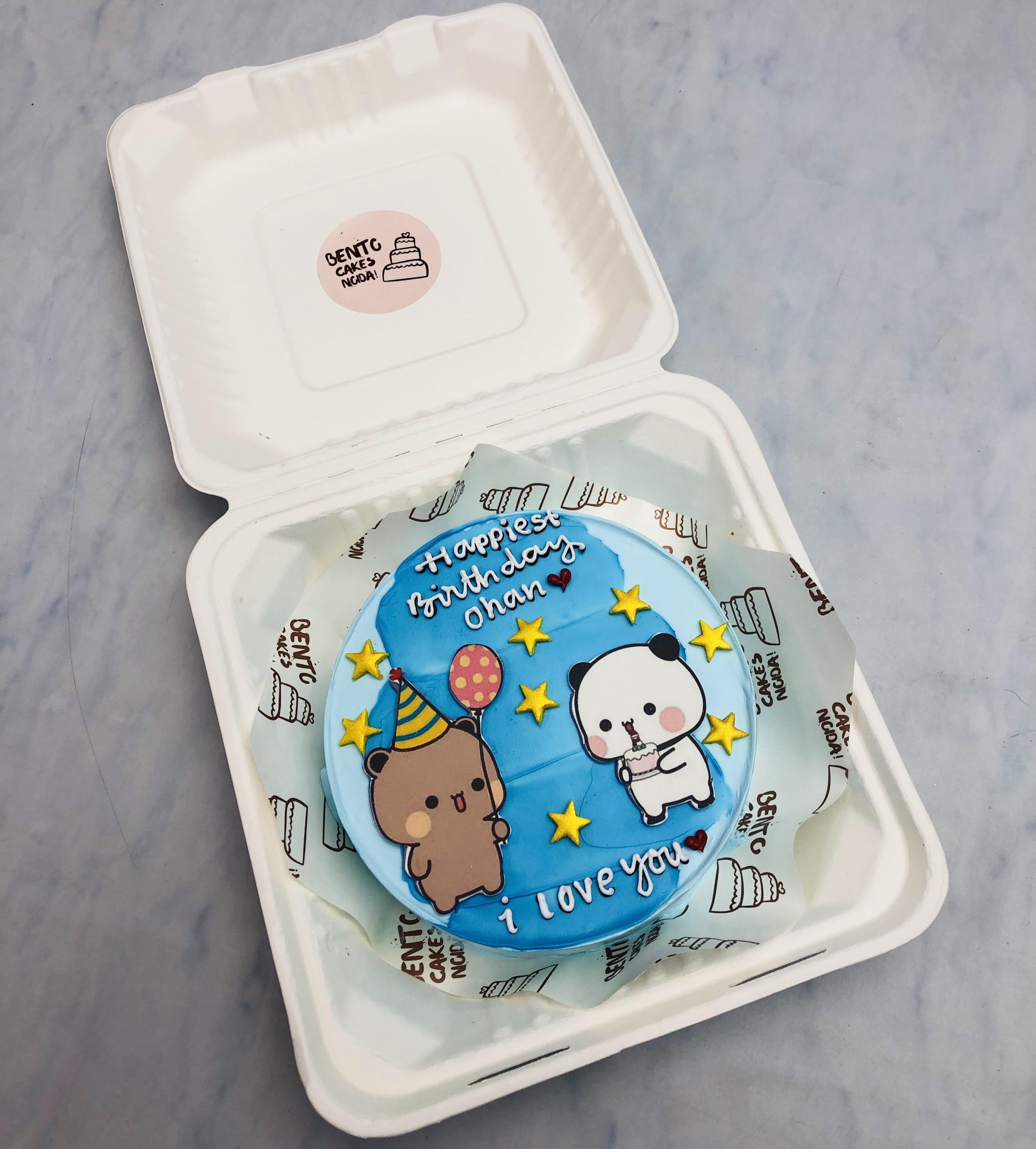 A skyblue bento cake with birthday celebrating bubu dudu theme, decorated with golden stars.
