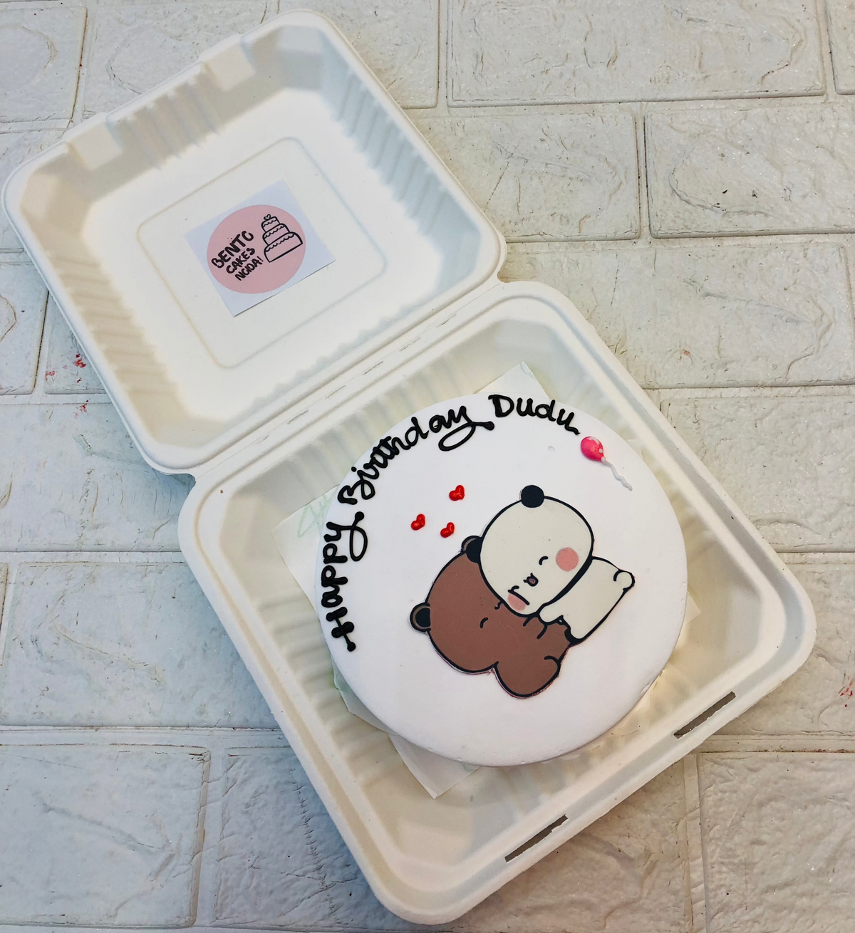 A white bento cake with loving bubu dudu celebrating dudu birthday.