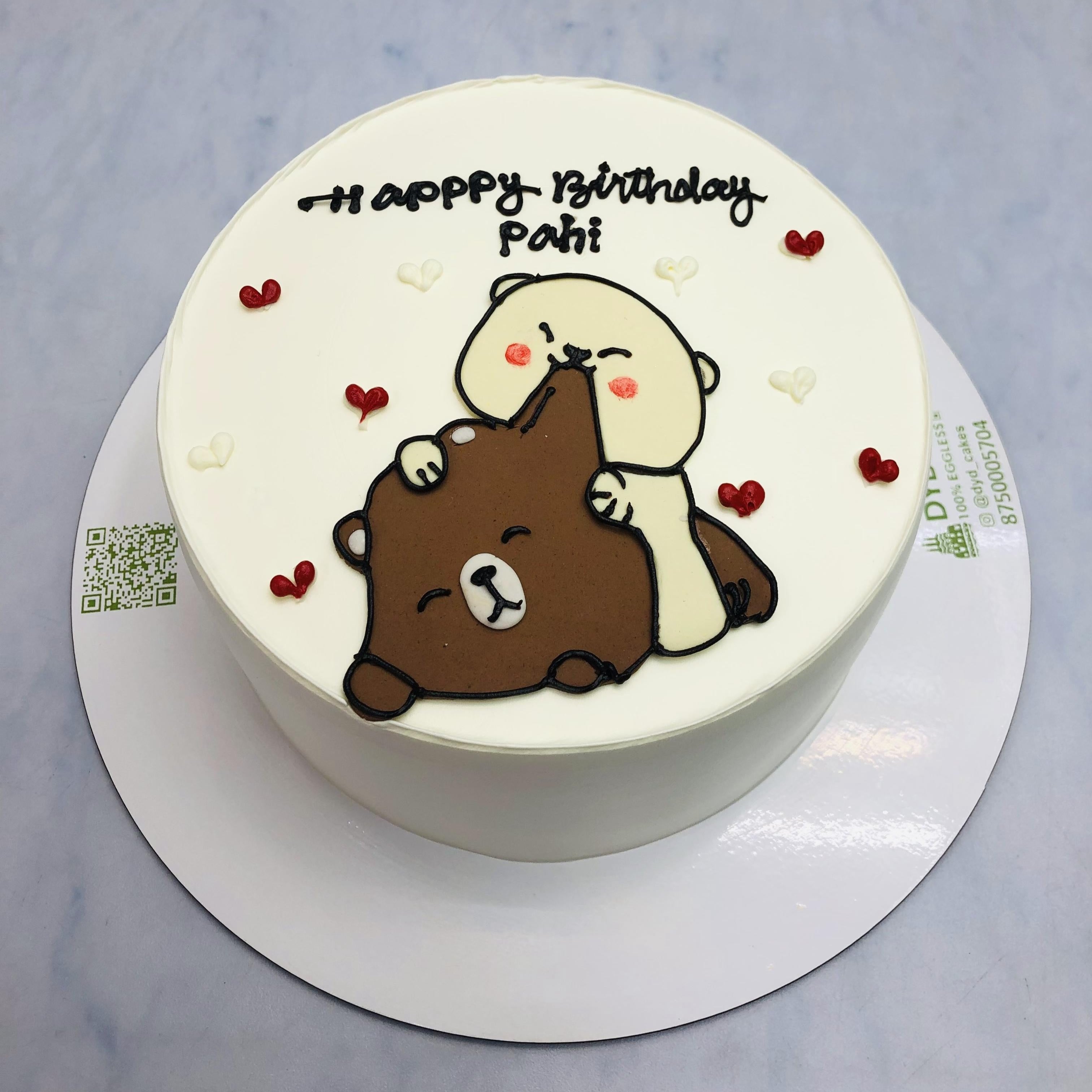 A whimsical cake featuring a Bubu Dudu design on top, perfect for a child's or couple's birthday celebration.