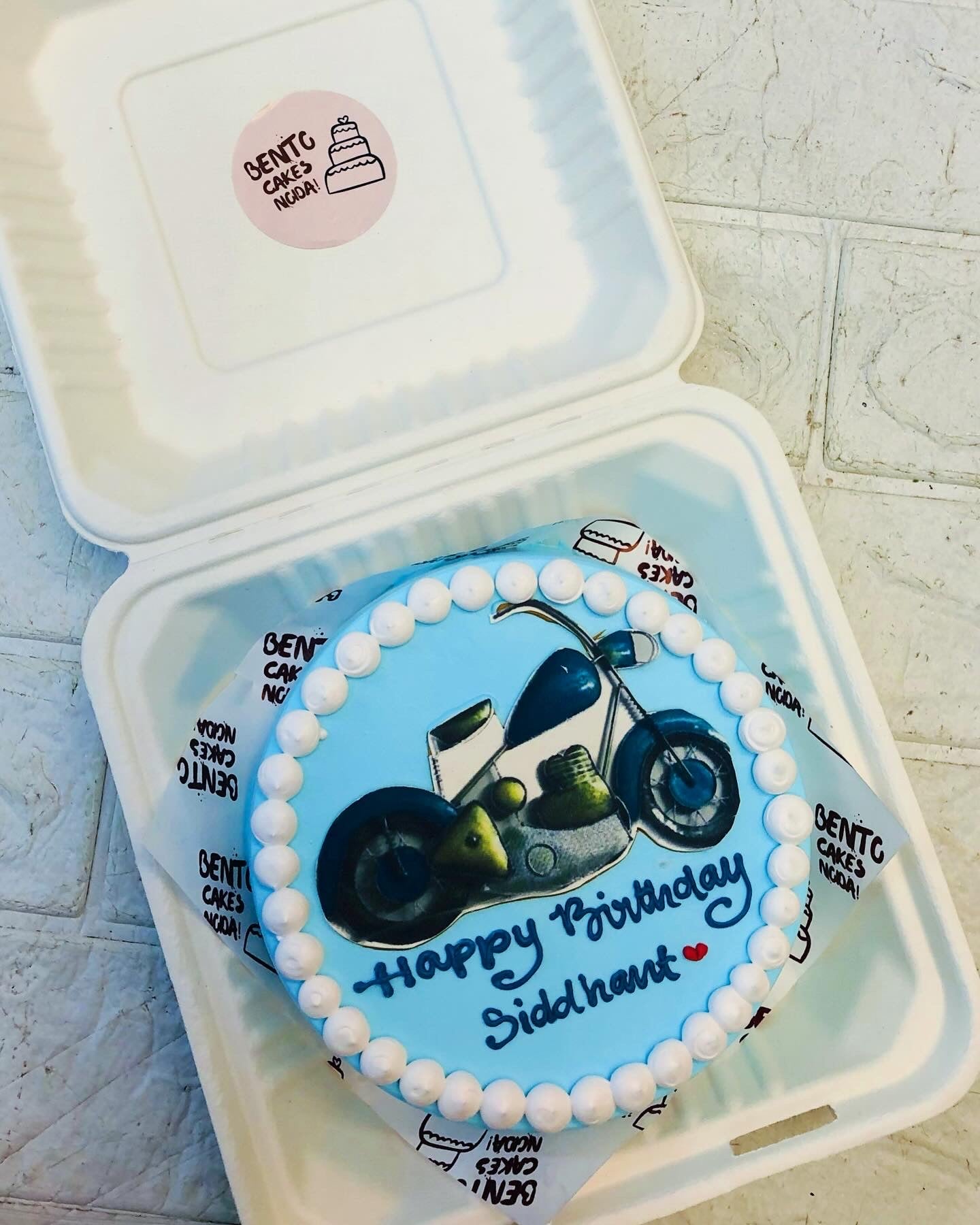 Asky blue bento cake with bullet bike print.