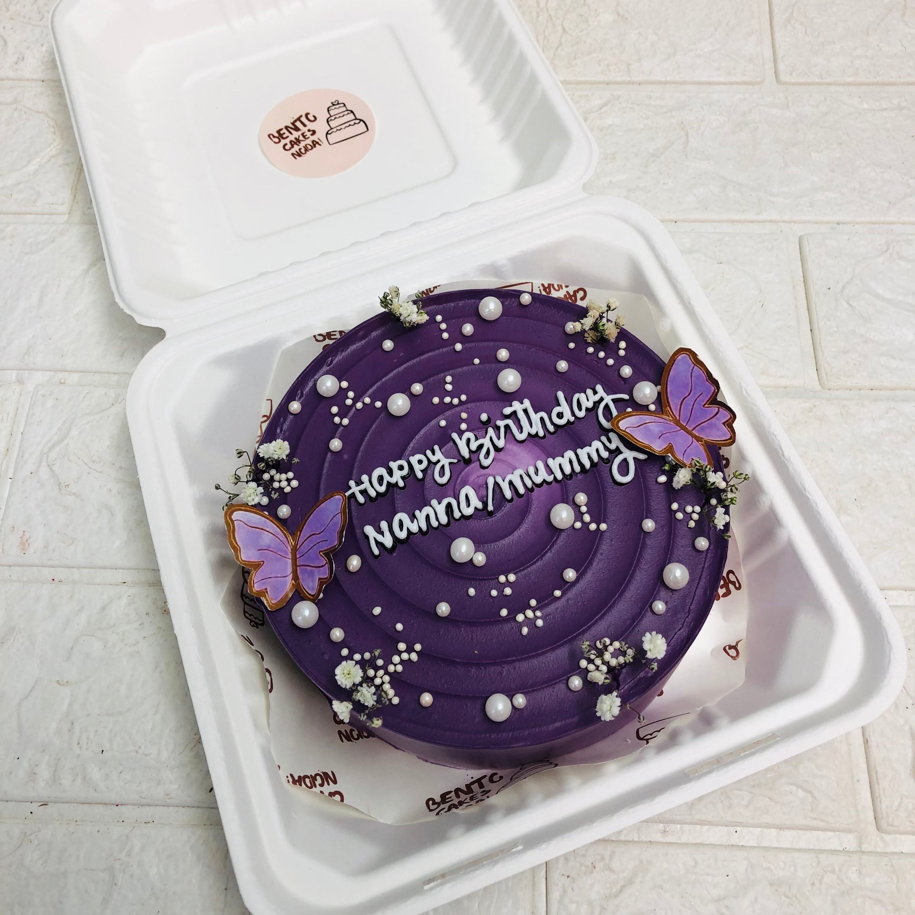 A delightful cake securely placed in a box, showcasing its elegant design and inviting appearance.