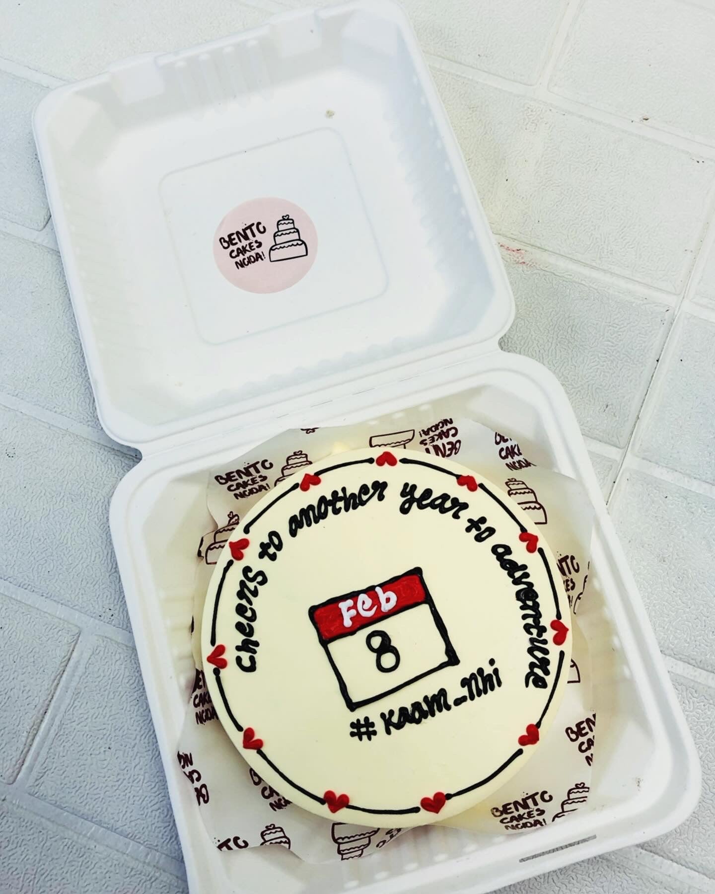 A white Calendar Theme Bento Cake for anniversary.
