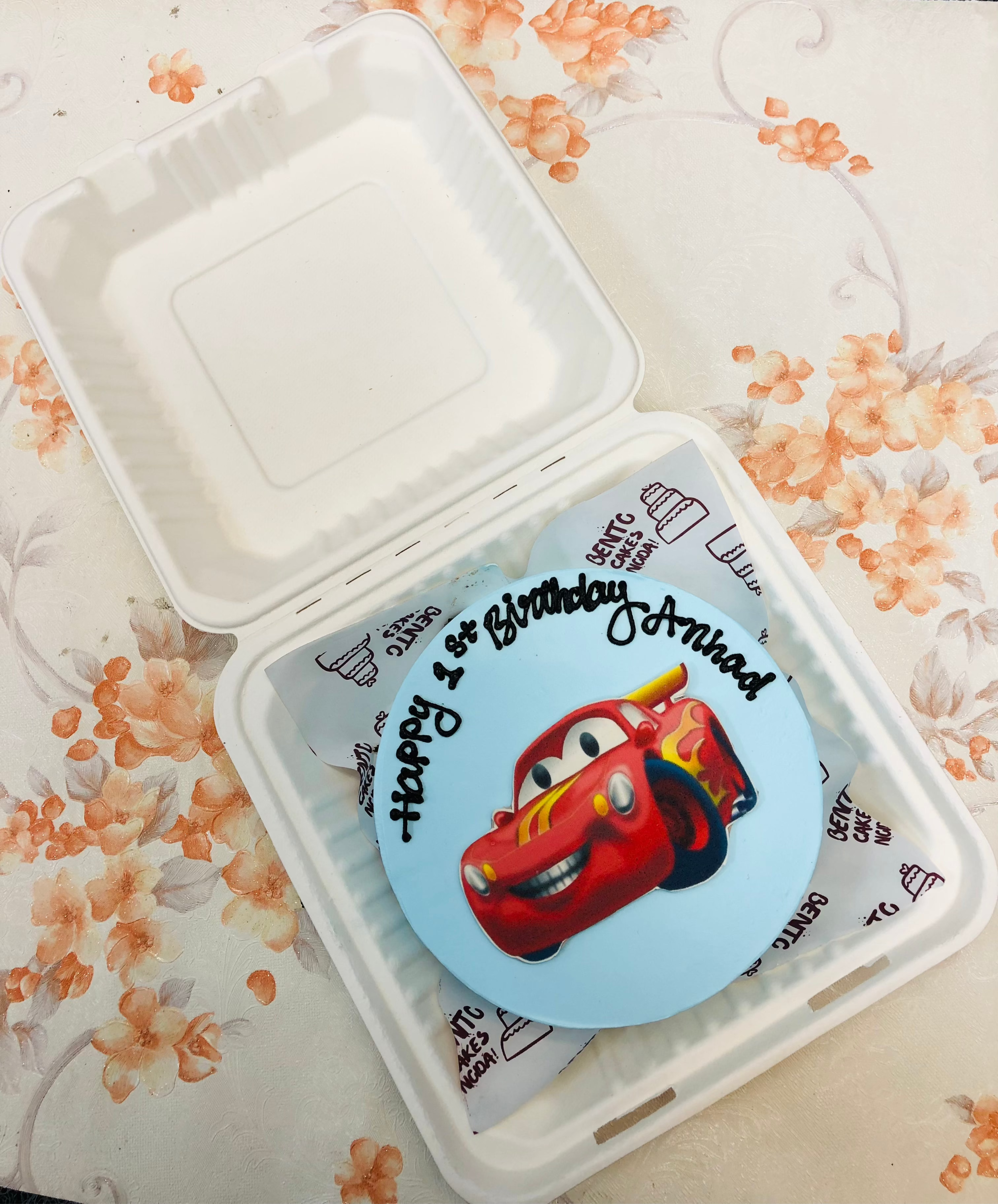 A cool blue bento cake having McQueen Cartoon.