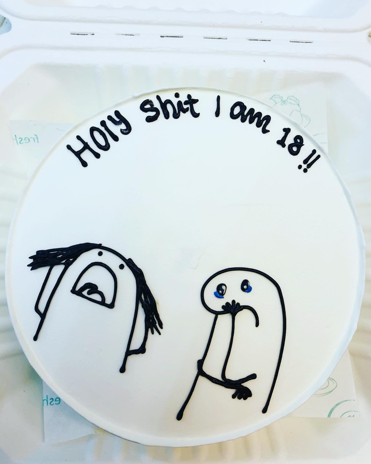 A white cake is decorated with 2 mimi cartoon characters and a text "Holy Shit I an 18!!" with black color written on tit.