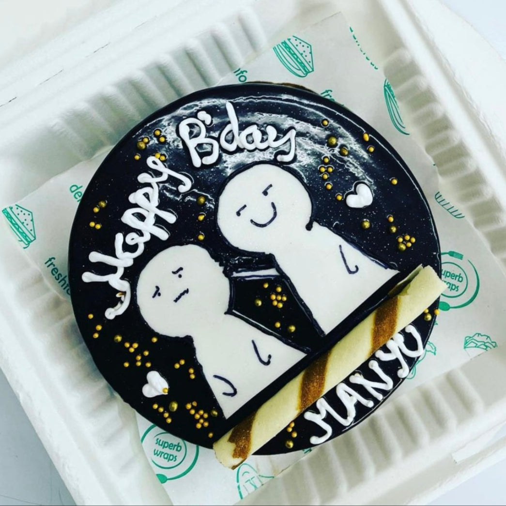 A decorative bento box showcasing a cake topped with two small figures, representing a joyful occasion.