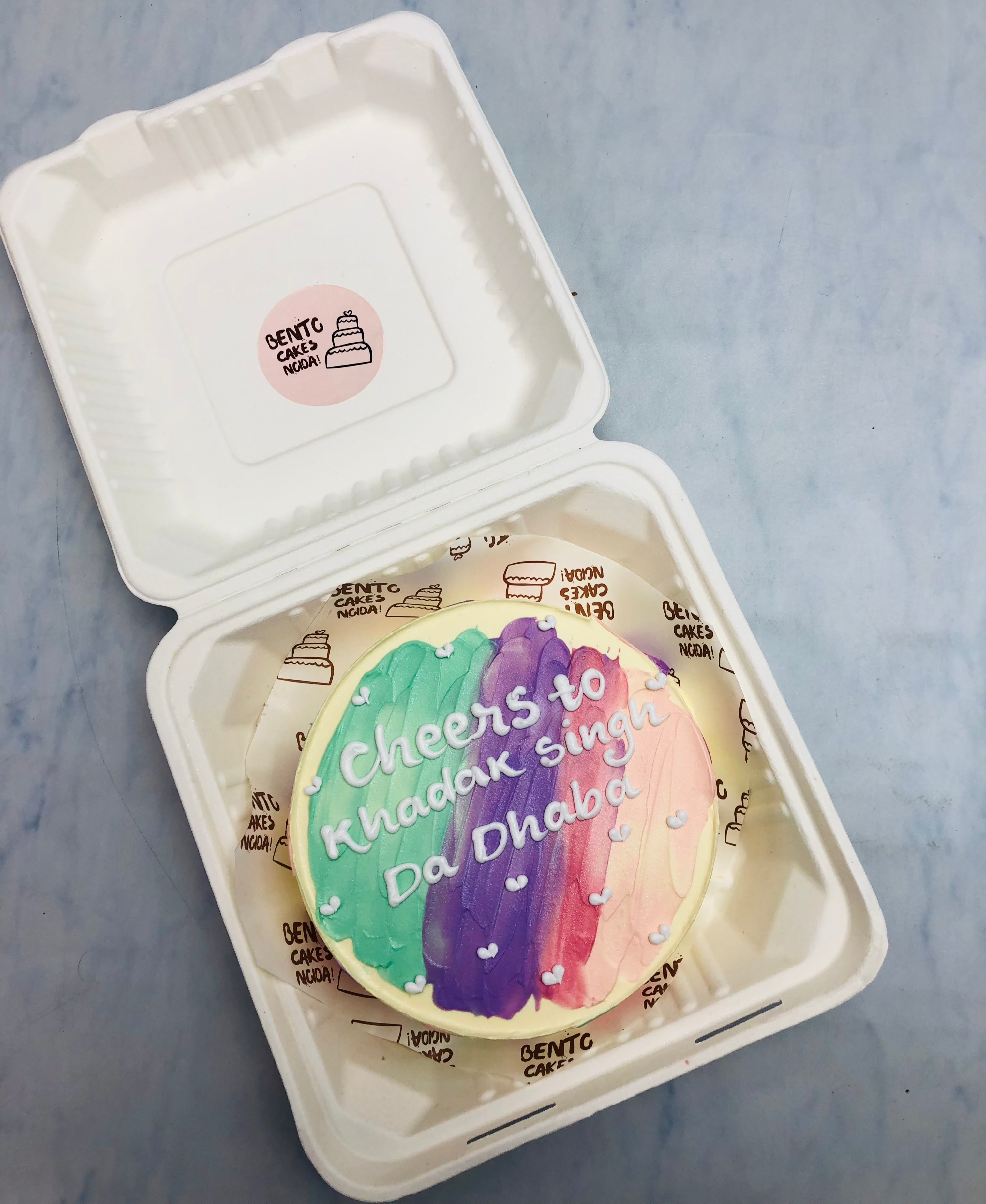 An aesthetic shades bento cake for corporate sectors promotion theme.