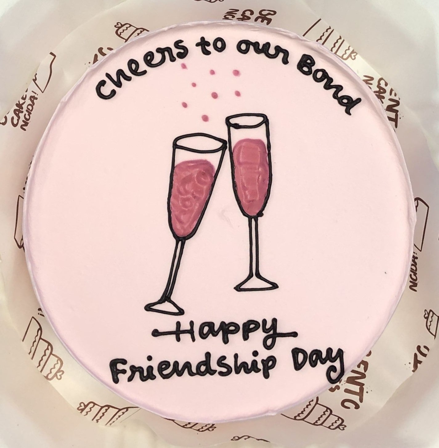 A rose pink bento cake having cheers glass for riendship day celebration.