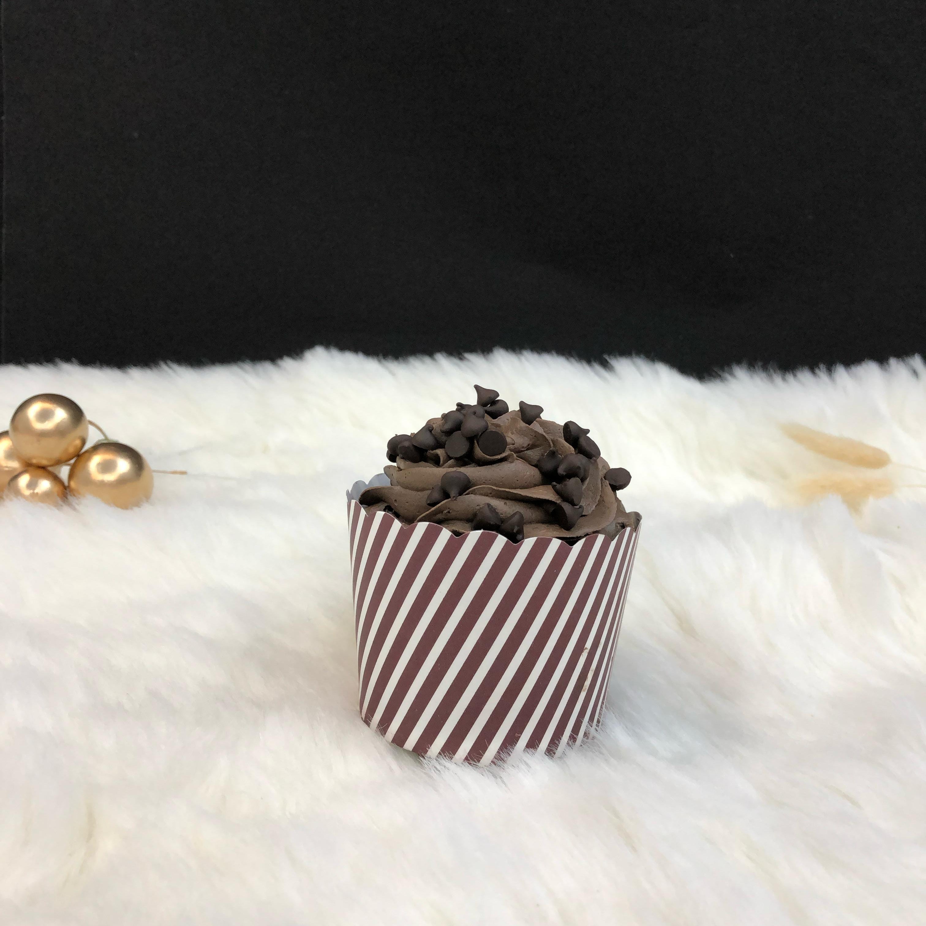 A cupcake filled with chocochip.