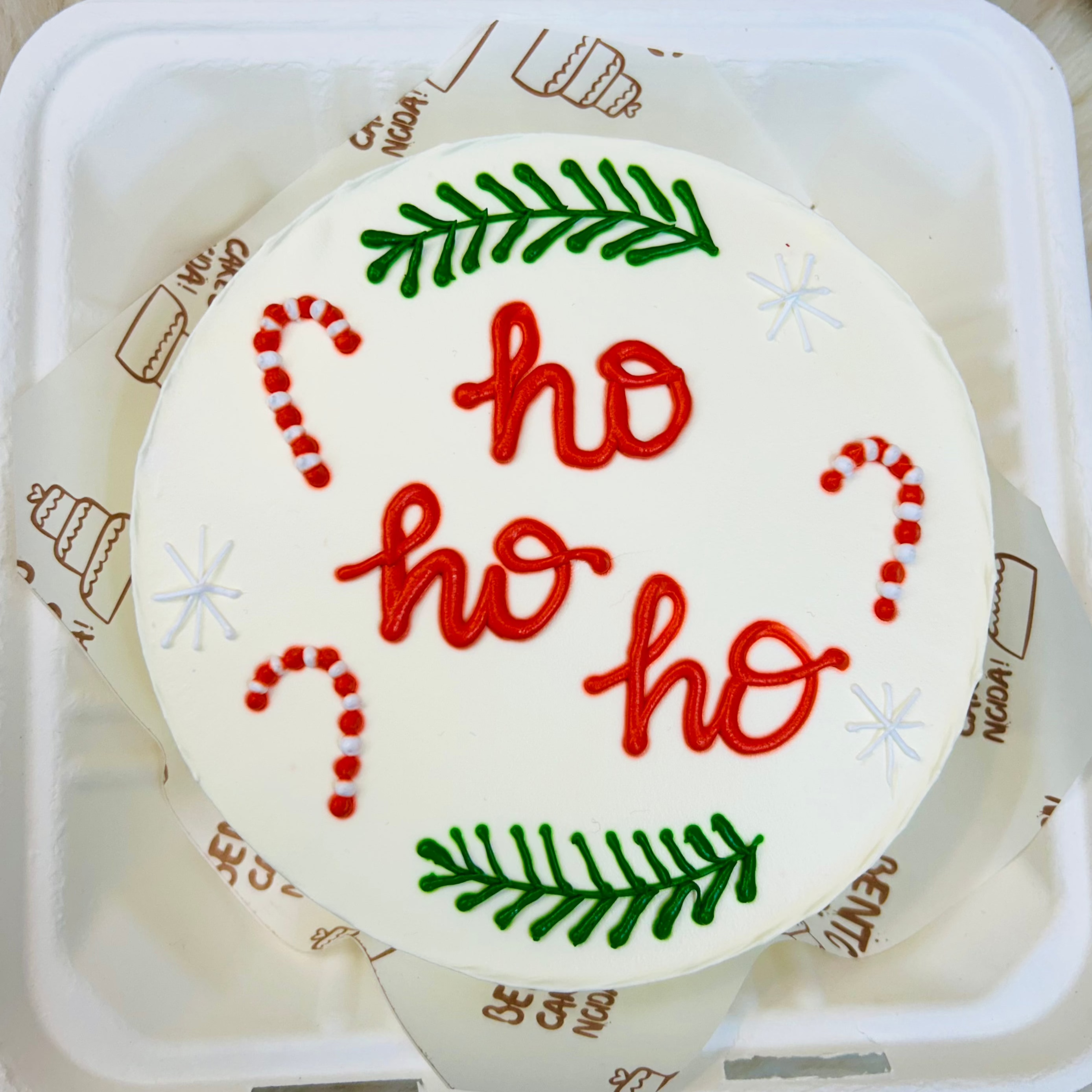 A white bento cake is designed for christmas festival with santa clause coming noise.
