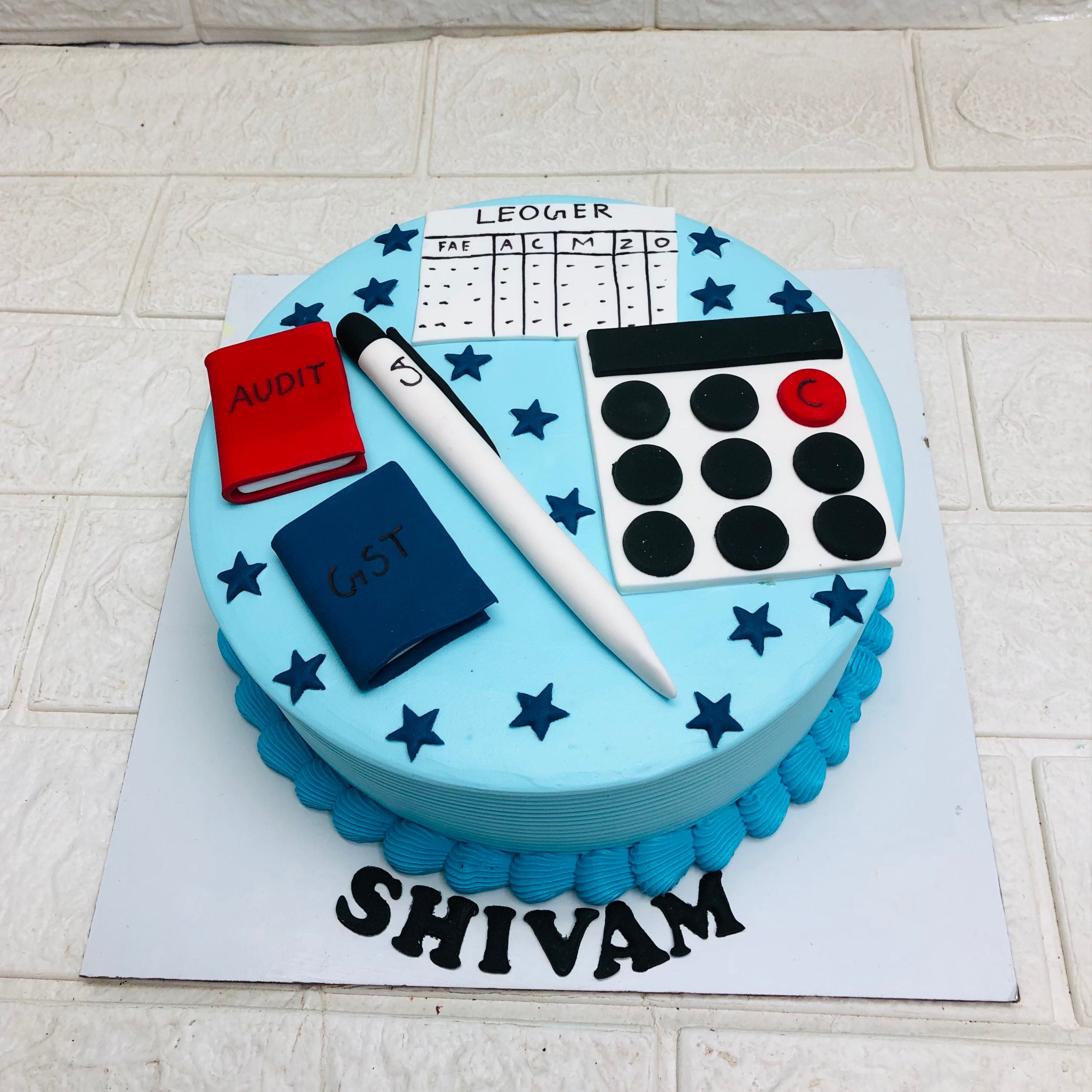 A birthday cake placed next to a calculator and other festive items, highlighting a creative blend of celebration and learning.