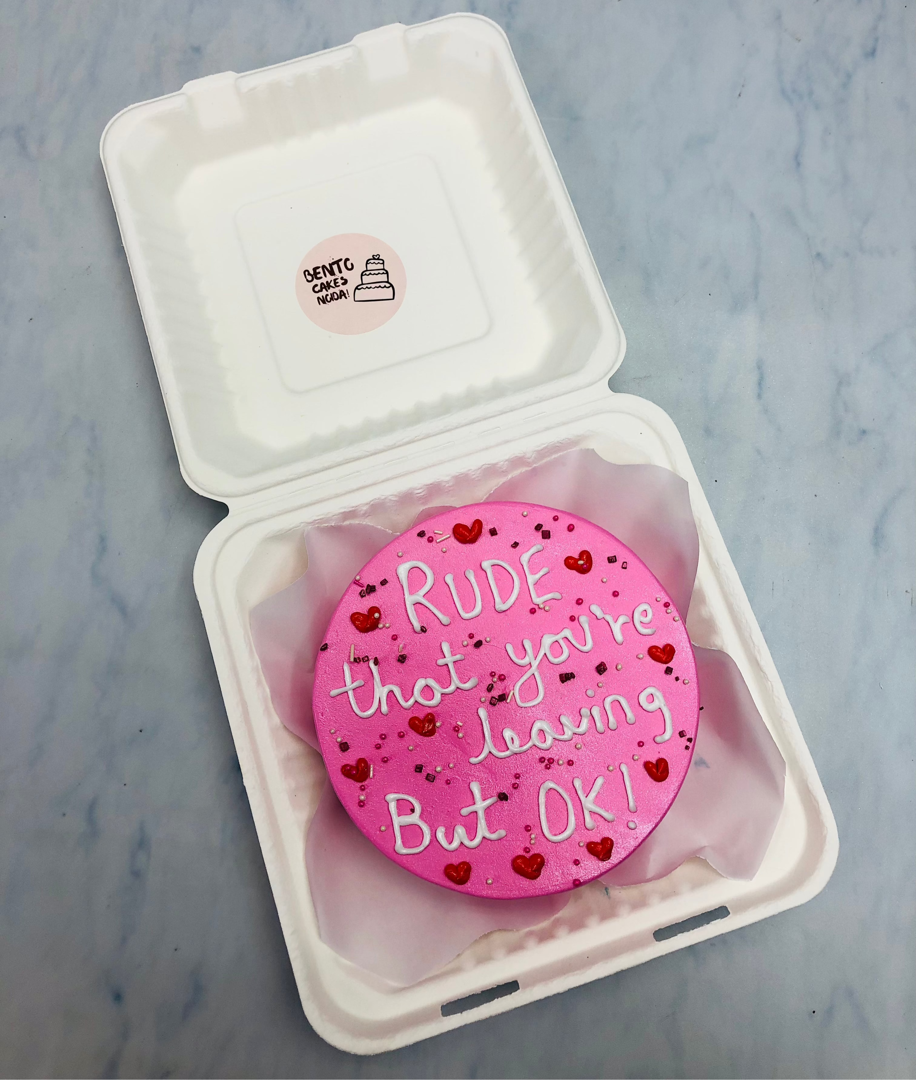 A customized pink bento cake for farewell theme with a loving text written on it.