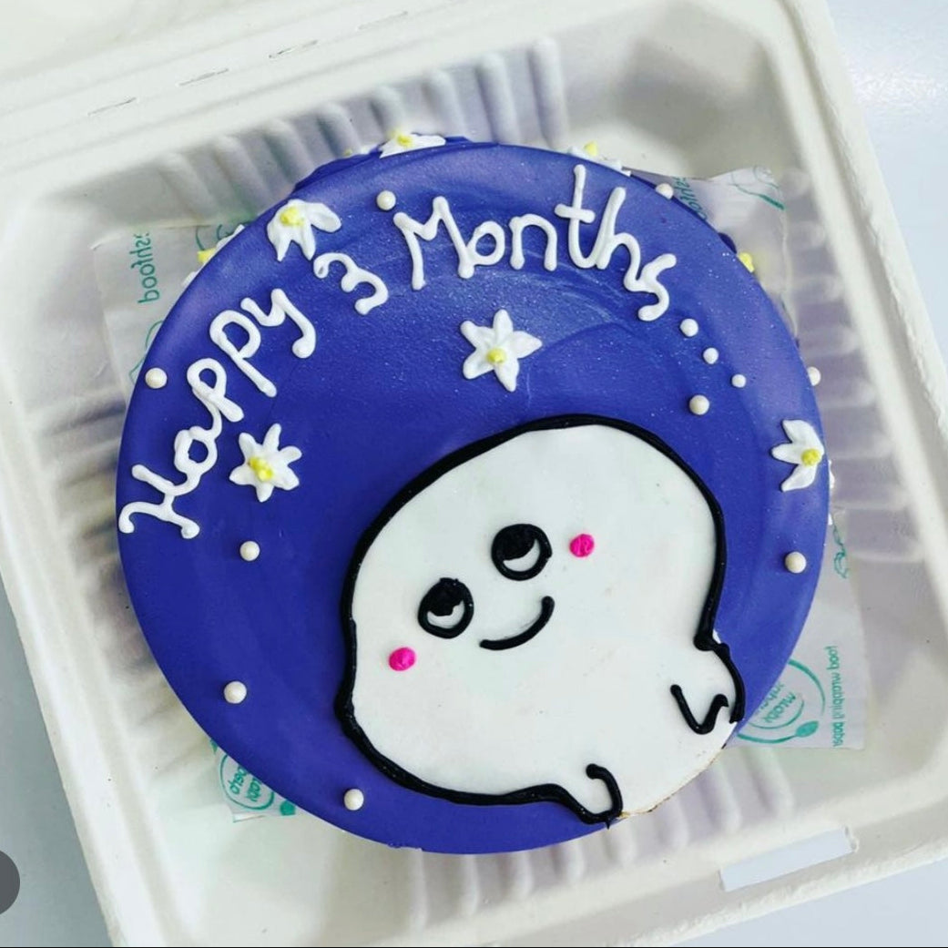 A delightful cake adorned with a "Happy 3 Months" text and a cartoon baby sticker, celebrating a baby's special milestone.