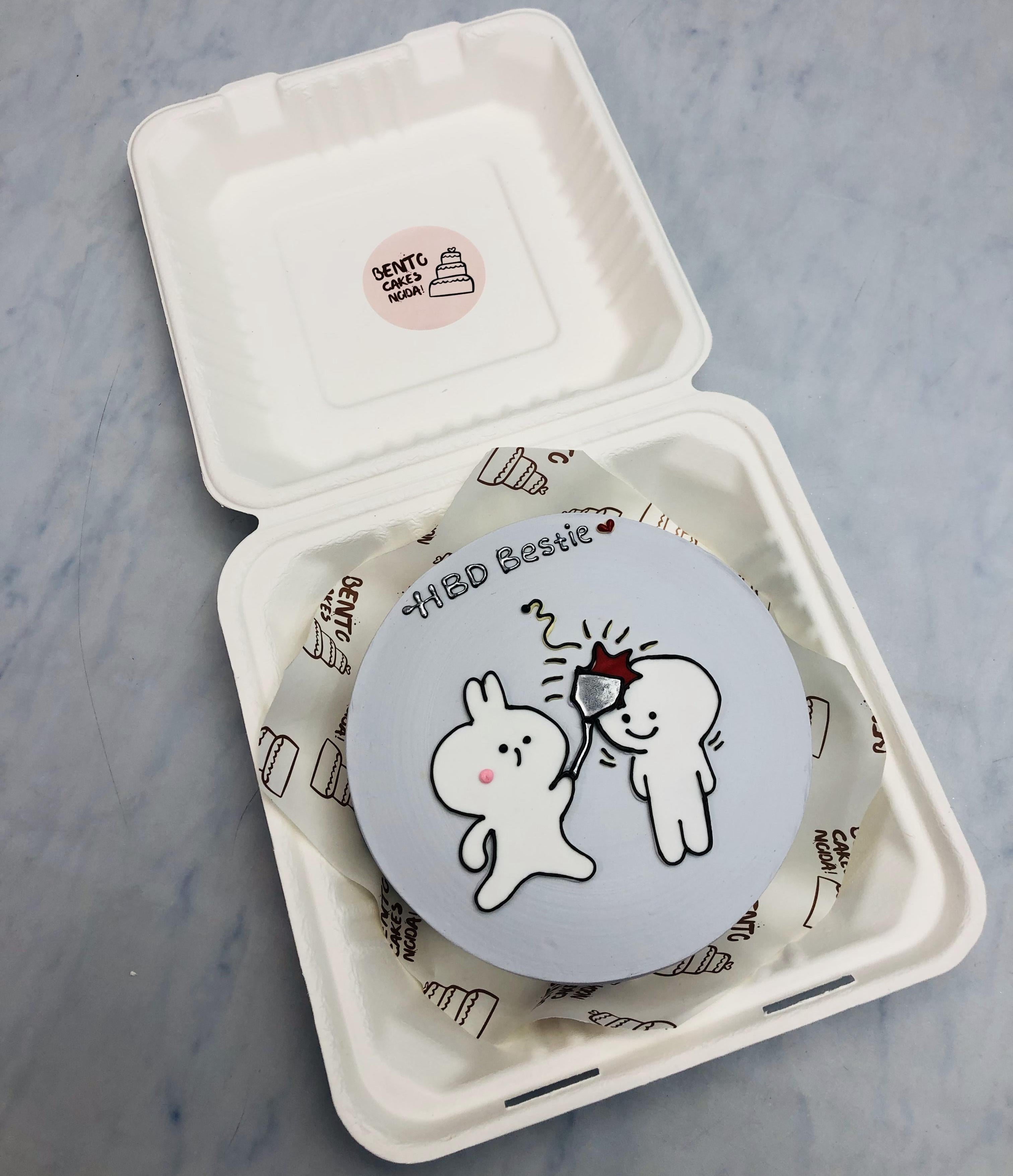A grey bento cake showing cartoon friends beating another with sick.