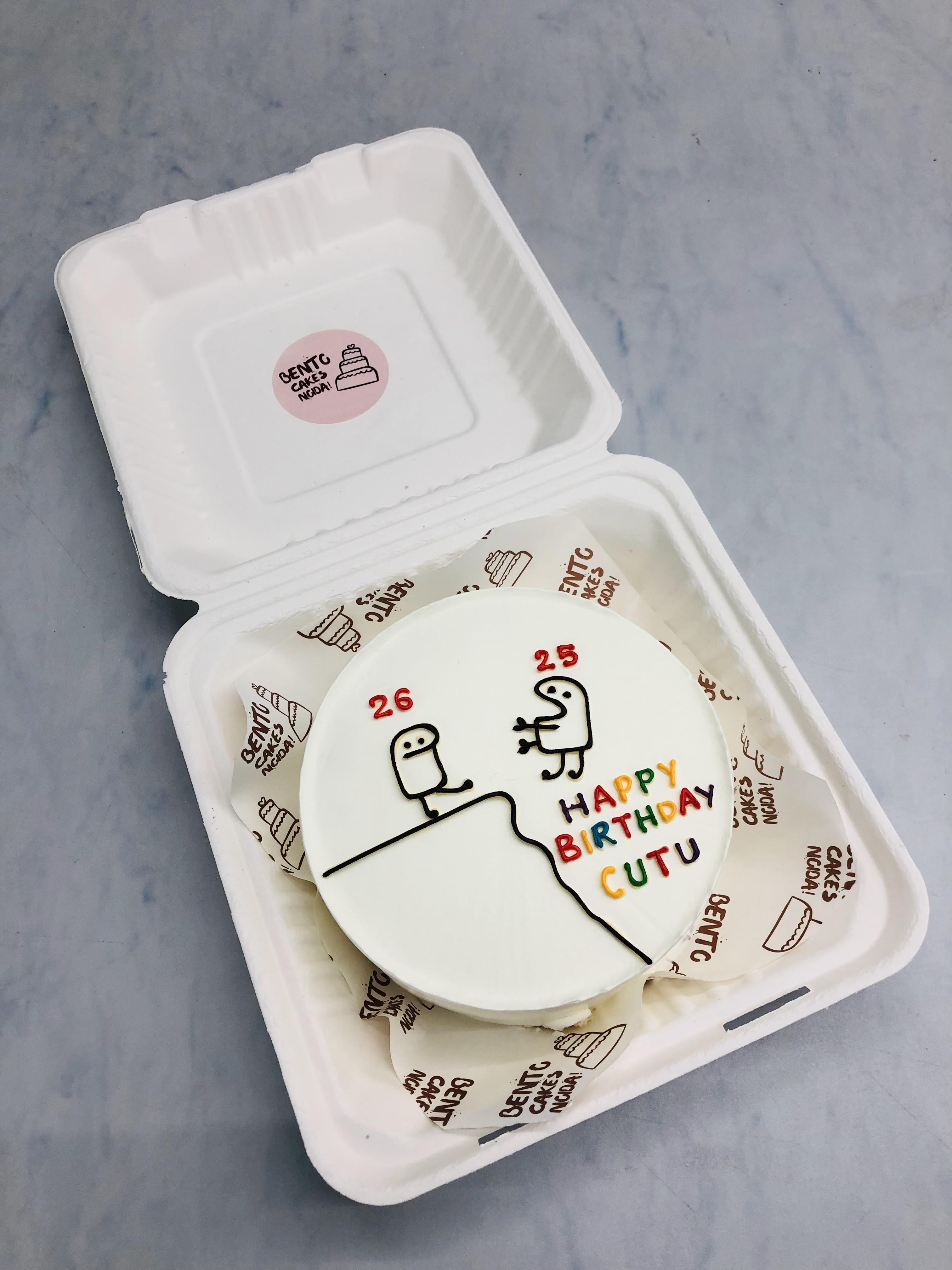 A white cake designed with 2 cartoon characters on its top and having a text "HAPPY BIRTHS"DAY CUTU" written on it in colorful latter's.