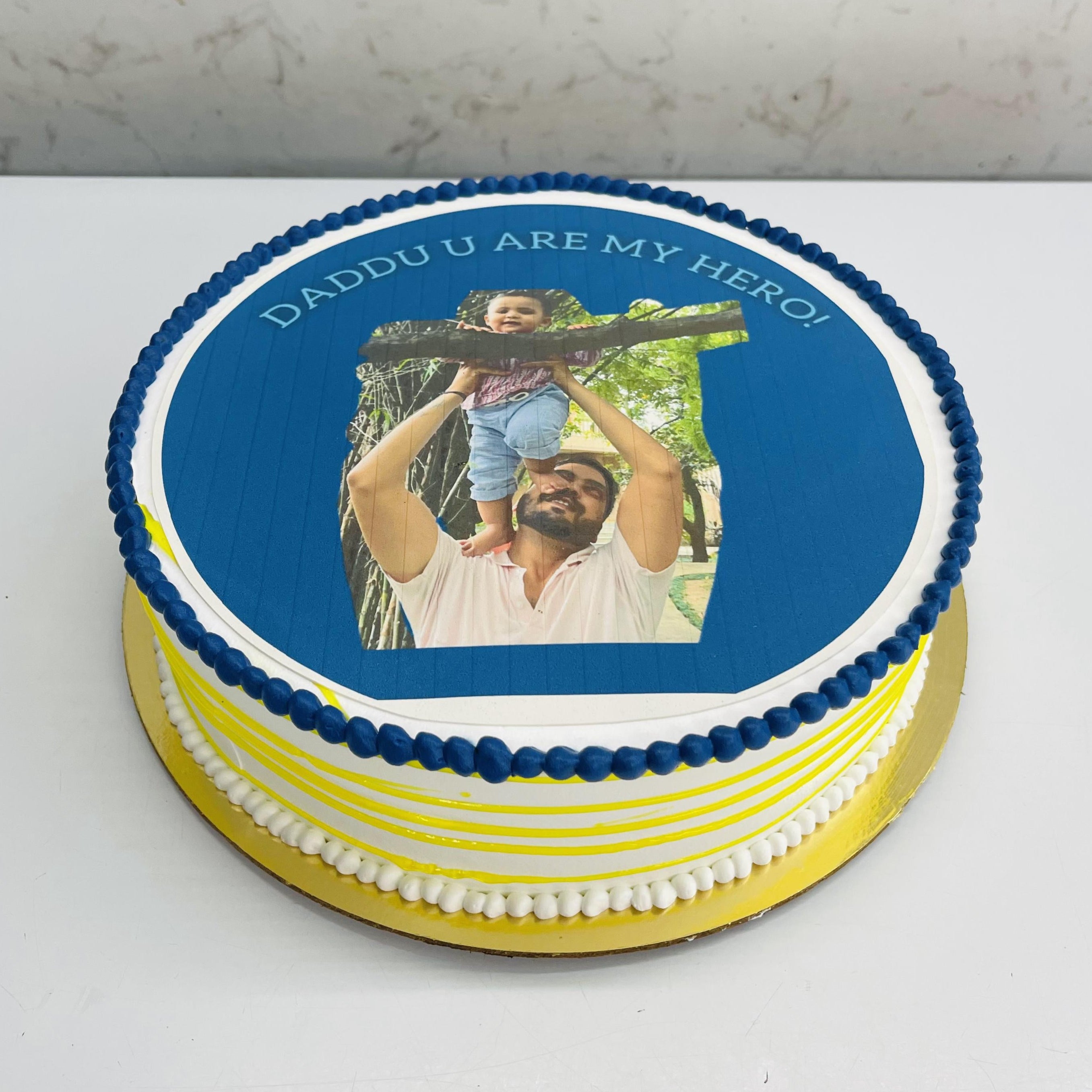 A white yellow Dad-Son Theme Cake