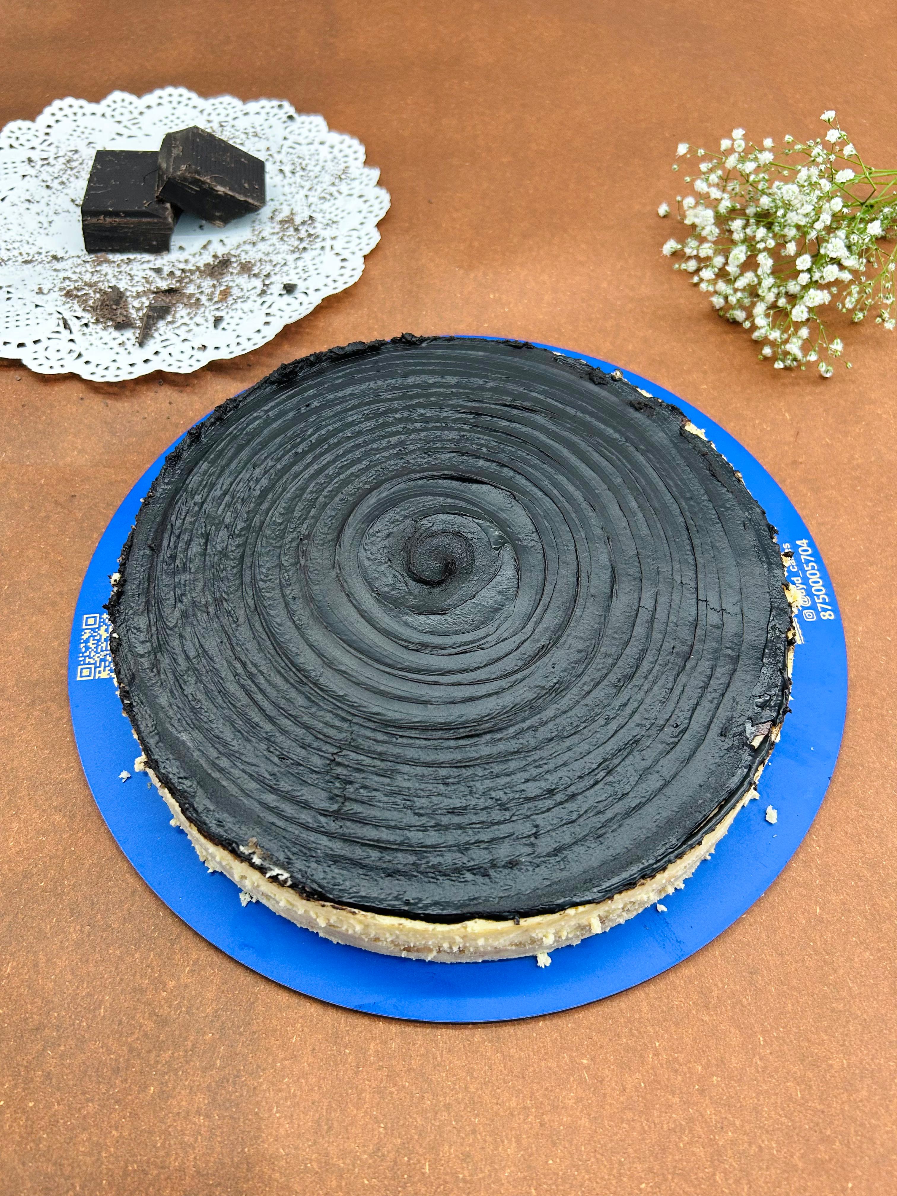 Decadent and rich, this velvety cheesecake combines the enticing flavors of dark chocolate in every luscious bite.