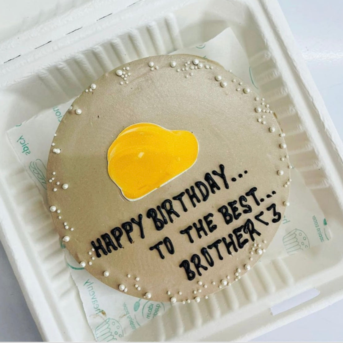 A birthday cake in a soft foam container, adorned with the message "Happy Birthday to the Best Brother."