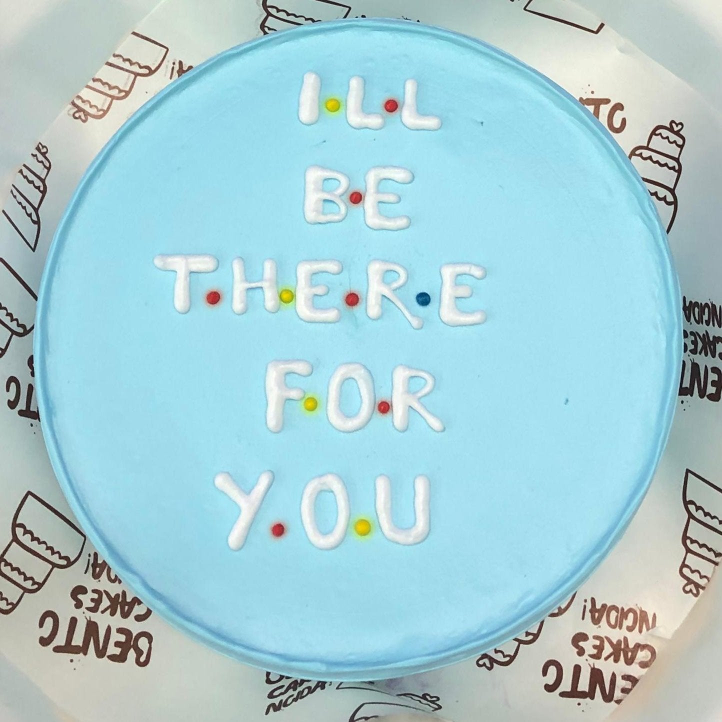 I LL BE THERE FOR YOU friendship text written with white icing on a skyblue bento cake.