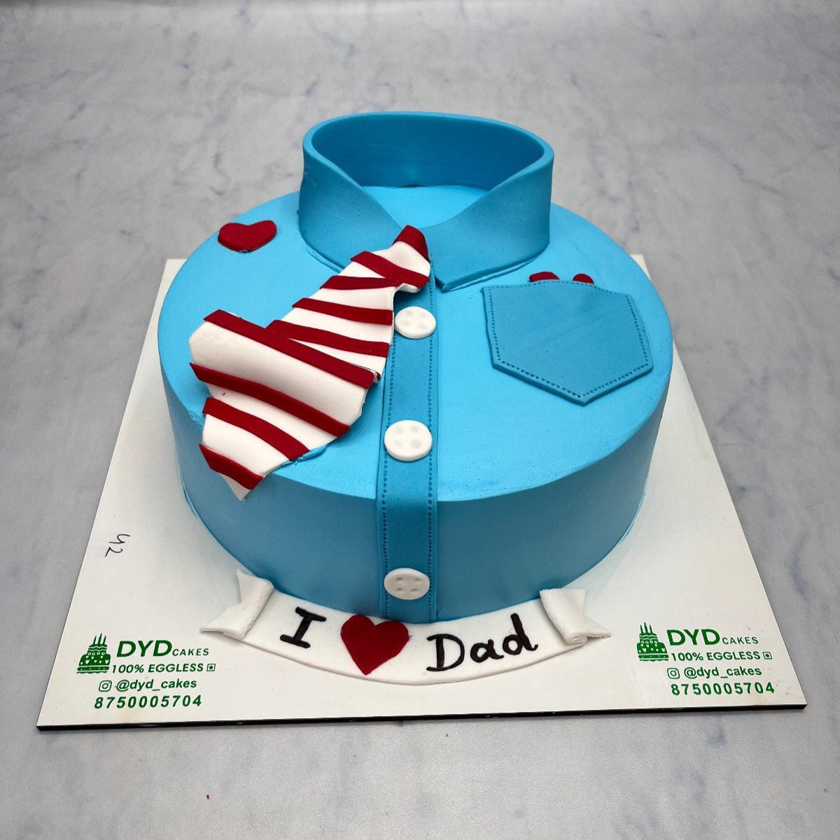 A Fathers Love Theme Blue Cake with shirt design.