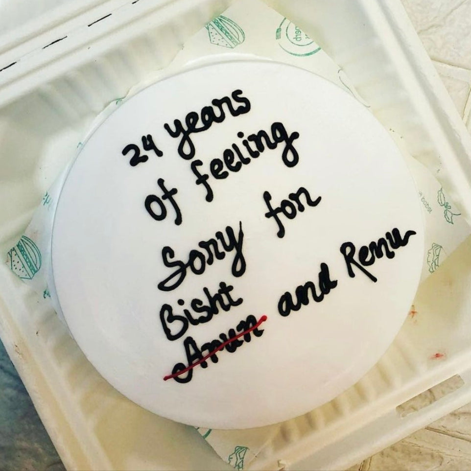 A bento box with a beautiful text on top of the cake, showcasing a delightful dessert ready to be enjoyed.