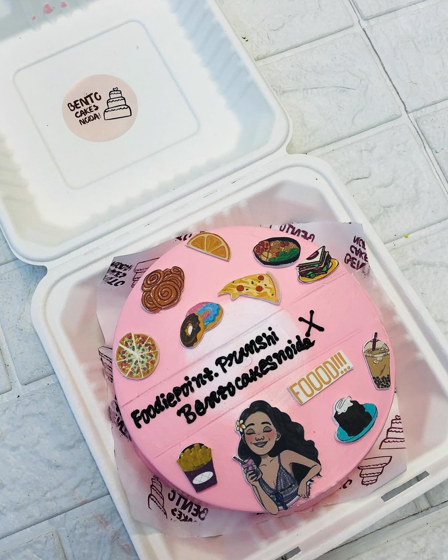 A pink bento cake is designed for a commercial food blogger.